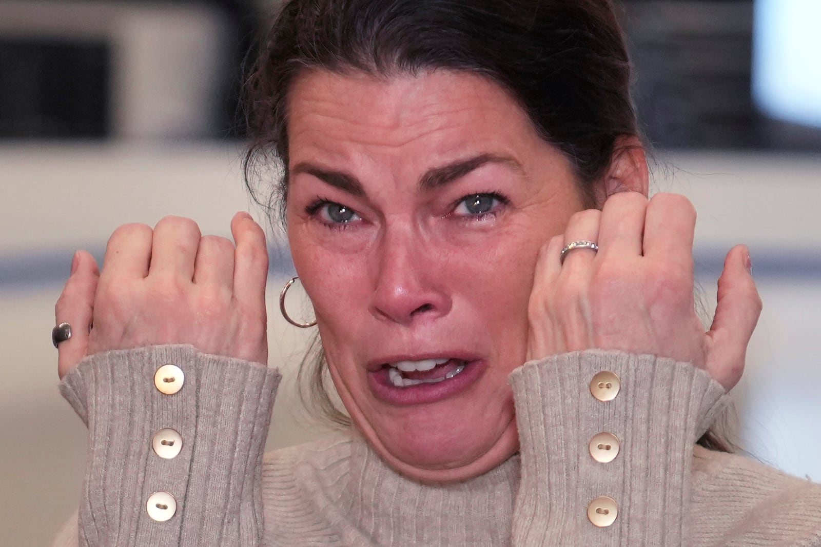 Former Olympic skater Nancy Kerrigan tries to hold back her emotions while addressing the media at The Skating Club of Boston, where six members of the club's community, including athletes, coaches and family, were killed in an airplane collision with a helicopter on Wednesday in Washington, Thursday, Jan. 30, 2025, in Norwood, Mass. (AP Photo/Charles Krupa)