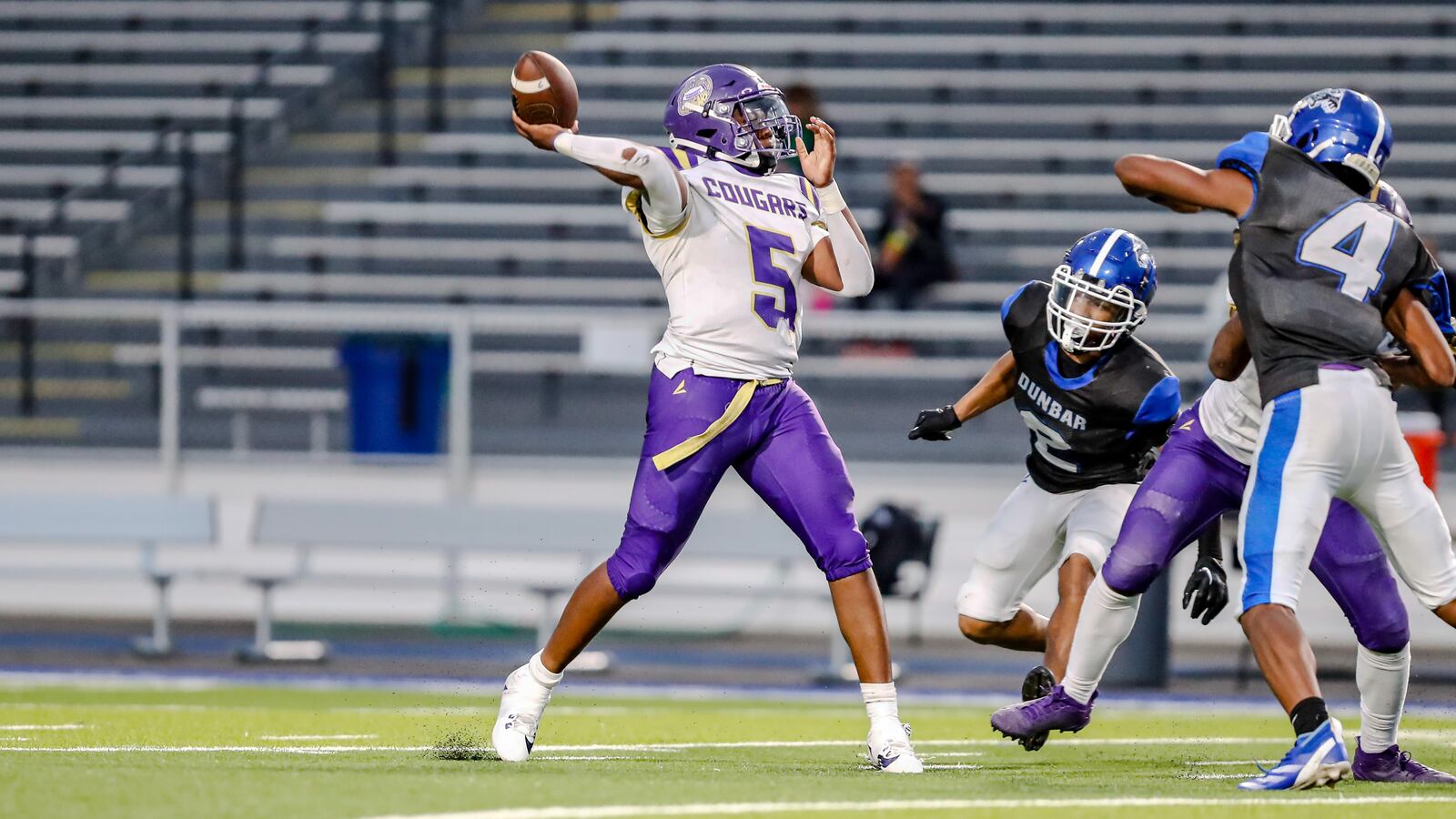 Thurgood Marshall High School senior Norman Spearman throws a pass during their game against Dunbar on Thursday, Sept. 26 at Dayton Welcome Stadium. The Wolverines won 22-6. Michael Cooper/CONTRIBUTED