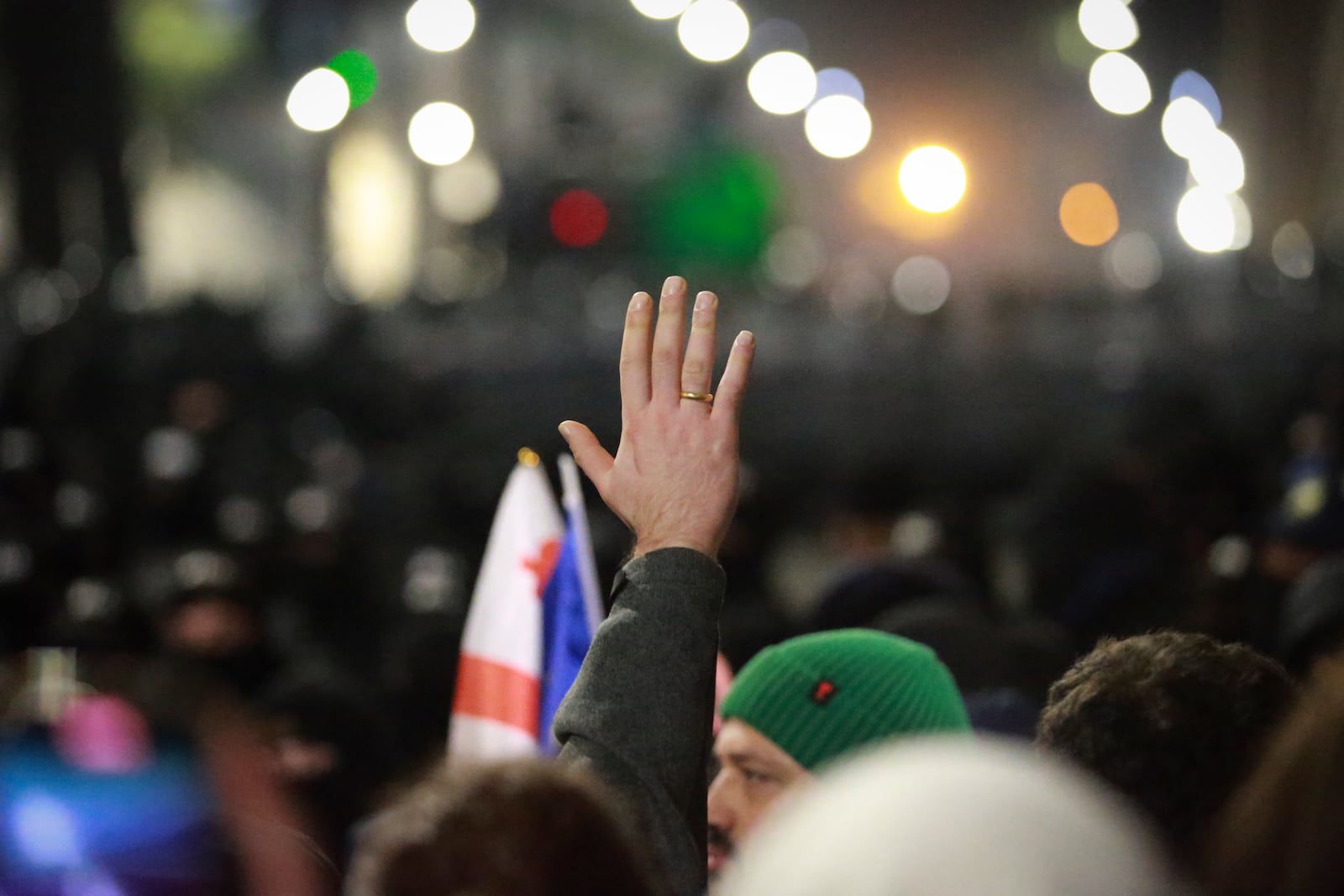 Demonstrators stand in front of police during a rally outside the parliament's building to protest the government's decision to suspend negotiations on joining the European Union for four years in Tbilisi, Georgia, on Saturday, Nov. 30, 2024. (AP Photo/Zurab Tsertsvadze)