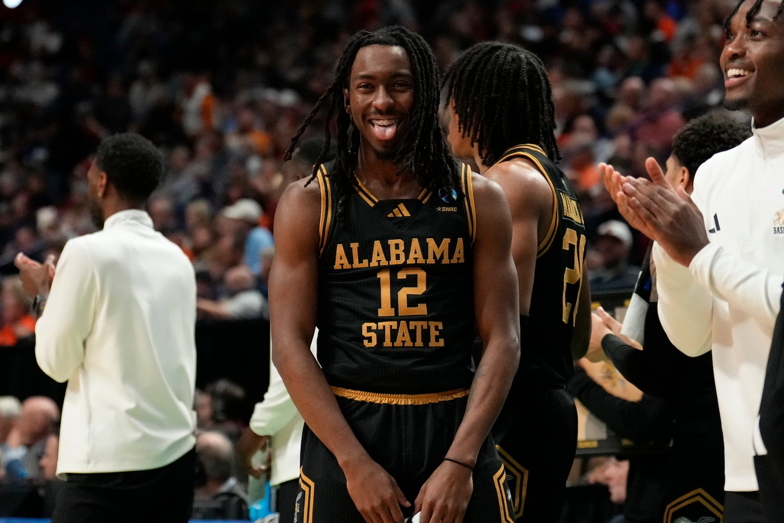 Alabama State guard Shawn Fulcher (12) and the the bench react to play against Auburn during the first half in the first round of the NCAA college basketball tournament, Thursday, March 20, 2025, in Lexington, Ky. (AP Photo/Brynn Anderson)