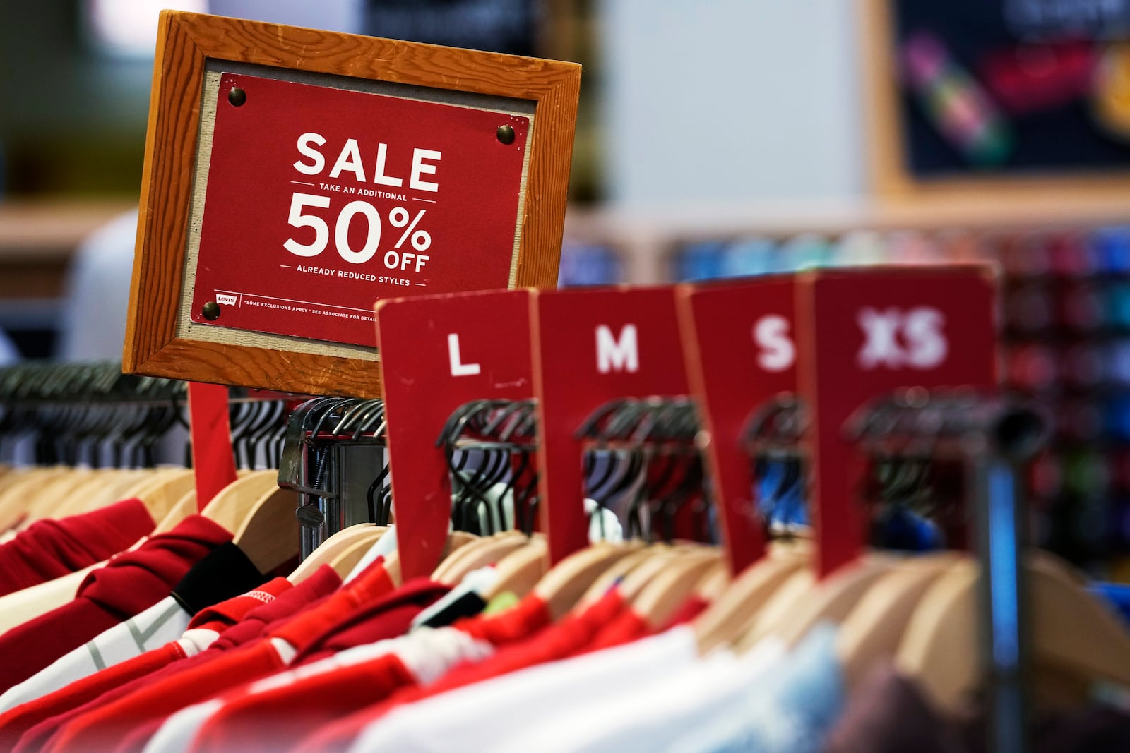 FILE - A sale sign is displayed on a rack of clothes at a store in Chicago, Monday, June 10, 2024. (AP Photo/Nam Y. Huh, File)