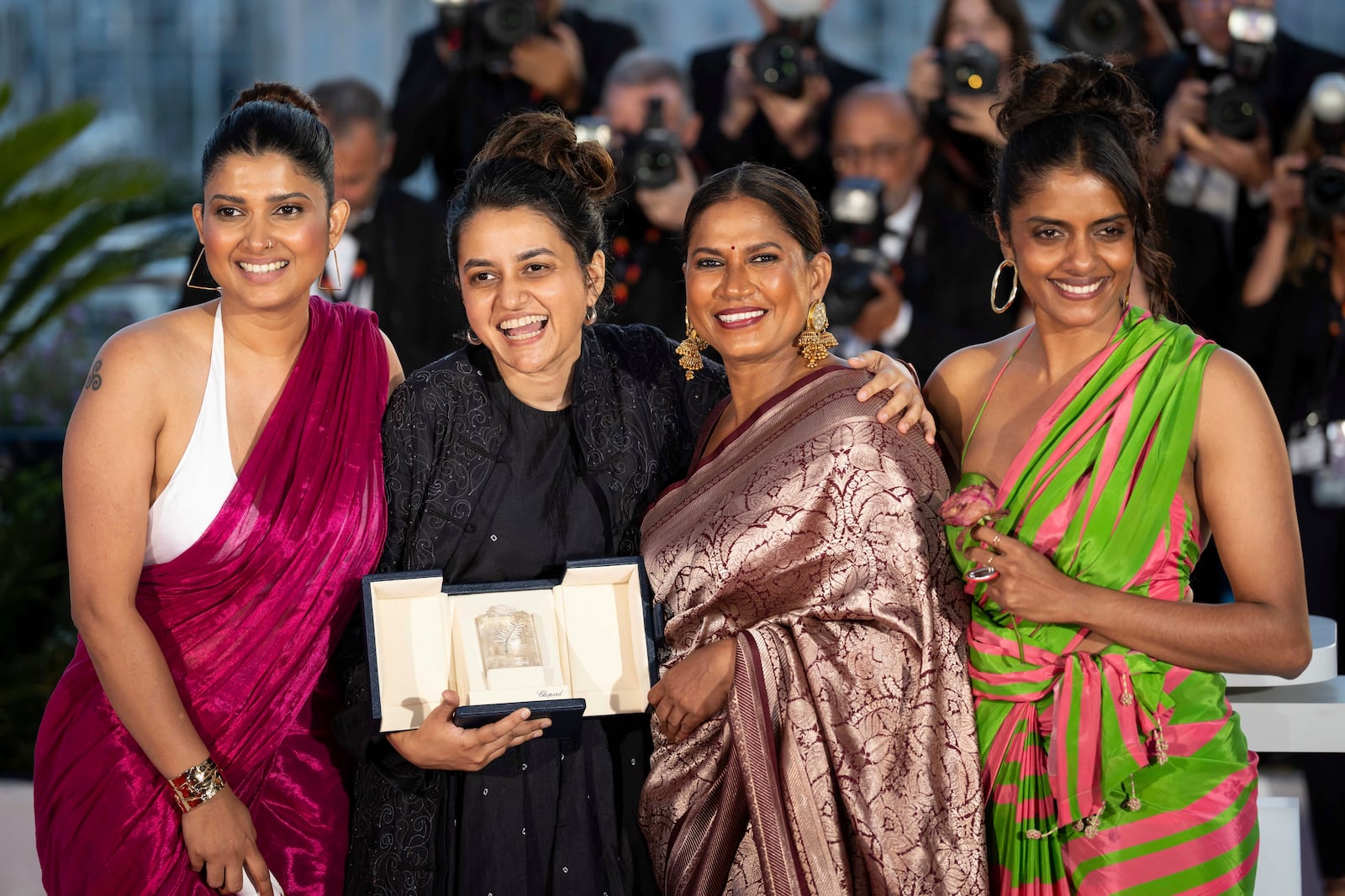 FILE - Filmmaker Payal Kapadia, second from left , winner of the grand prize for "All We Imagine As Light," poses with Divya Prabha, from left, Chhaya Kadam and Kani Kusruti after the awards ceremony at the 77th international film festival, Cannes, southern France, Saturday, May 25, 2024. (Photo by Scott A Garfitt/Invision/AP, File)