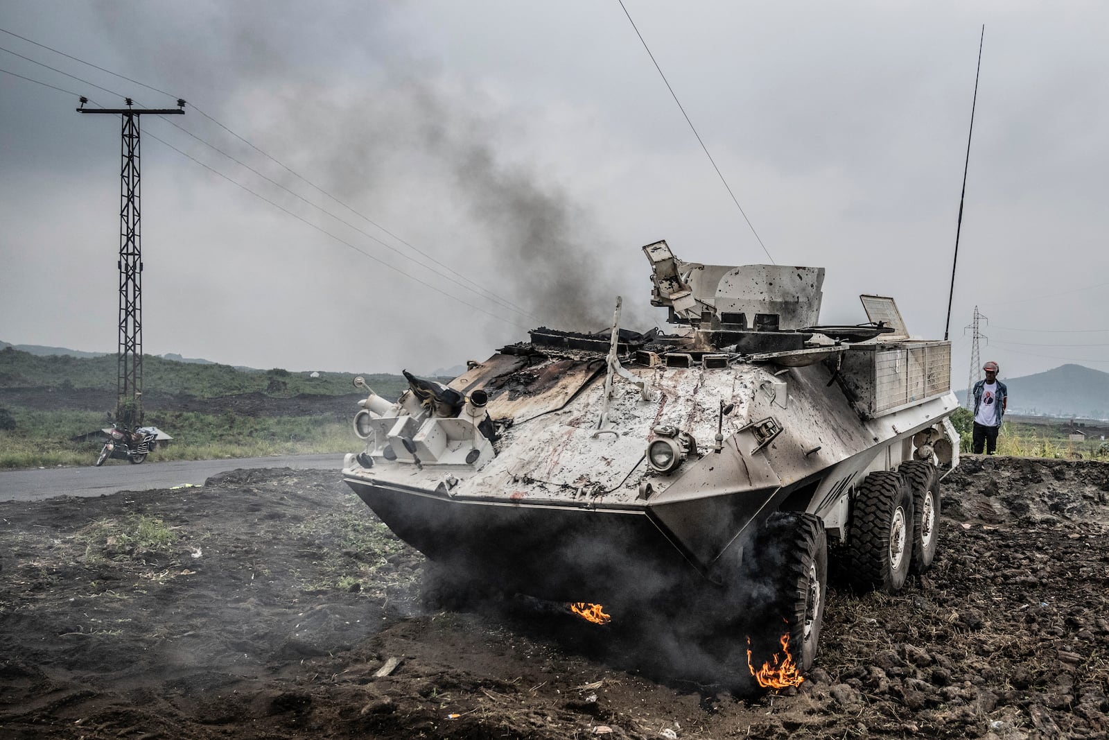 A UN armoured personnel carrier burns during clashes with M23 rebels outside Goma, Democratic Republic of the Congo, Saturday, Jan. 25, 2024. (AP Photo/Moses Sawasawa)