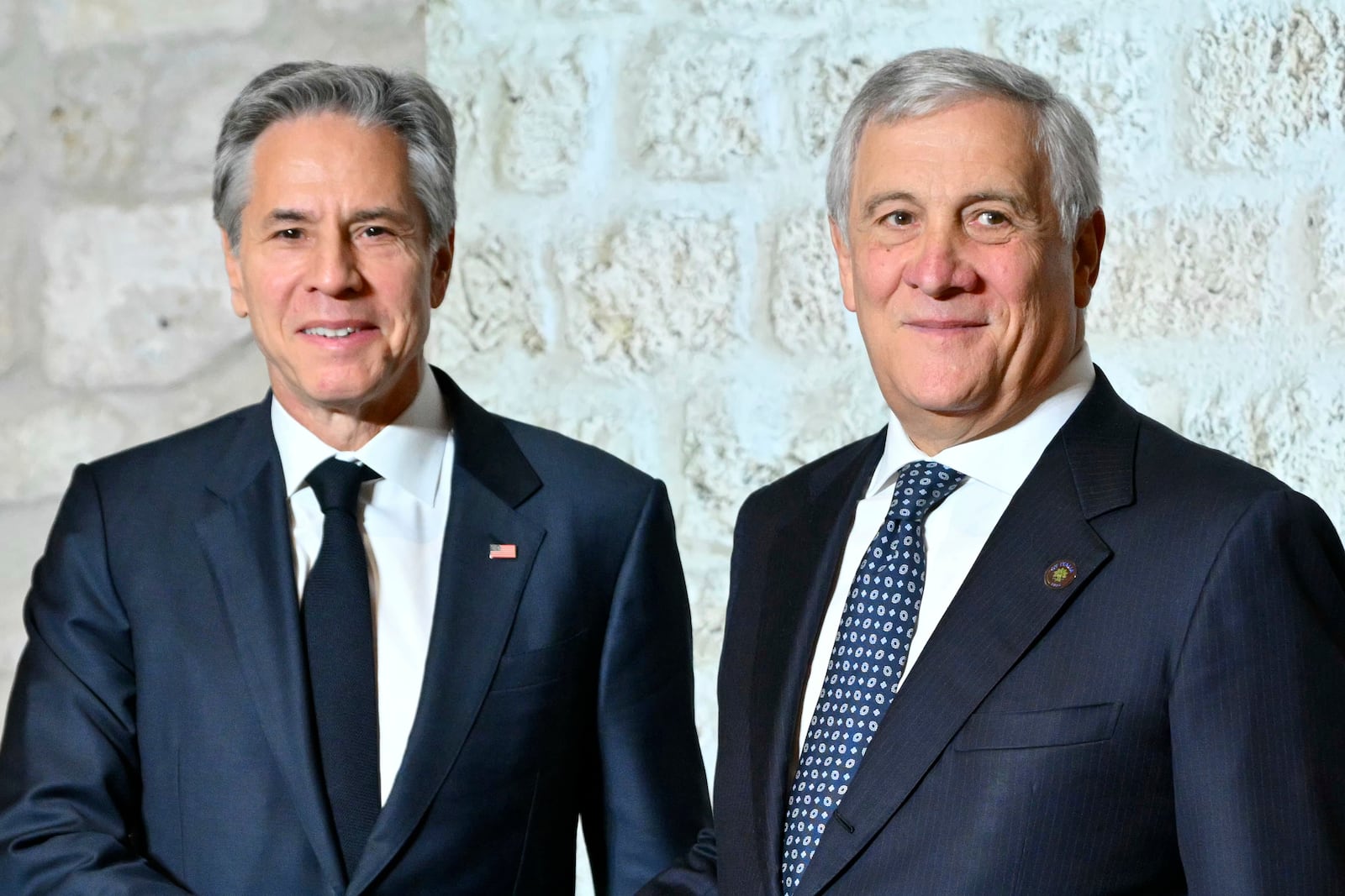 Italy's Foreign Minister Antonio Tajani, right, welcomes US Secretary of State Antony Blinken at the G7 Foreign Ministers meeting in Anagni, central Italy, Monday, Nov. 25, 2024. (Andreas Solaro/Pool Photo via AP)