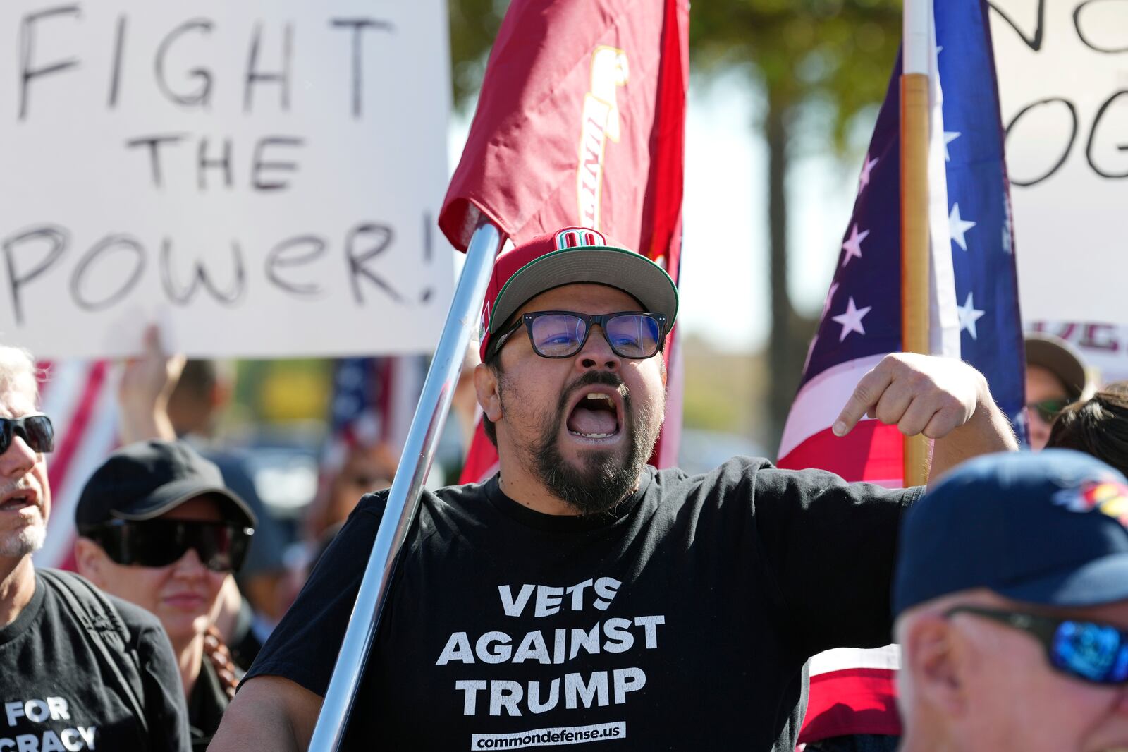 Ricardo Reyes, of Common Defense, shouts as he addresses the crowd as hundreds gather during a political protest at the Arizona Capitol Wednesday, Feb. 5, 2025, in Phoenix. (AP Photo/Ross D. Franklin)