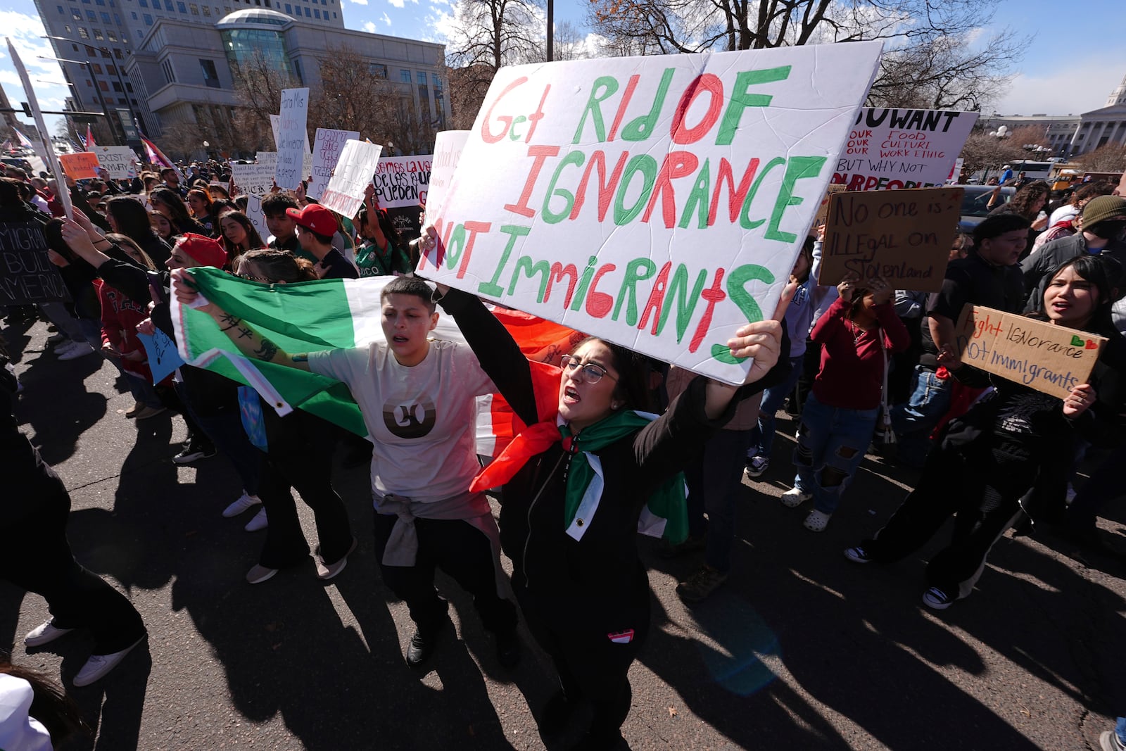 Participants cheer during a political protest outside the State Capitol Wednesday, Feb. 5, 2025, in Denver. (AP Photo/David Zalubowski)