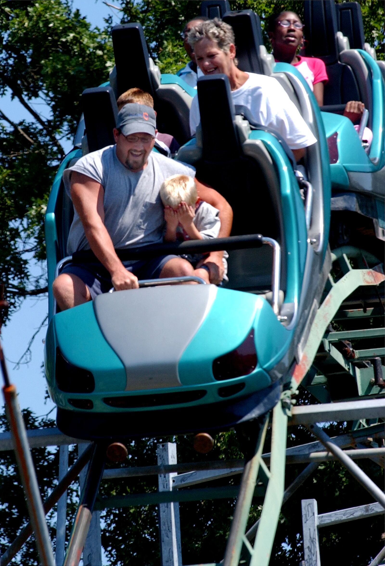 CINCINNATI /CONEY ISLAND MONDAY SEPTEMBER 5, 2005: James Erdman's five year old son Eddie hid his eyes as they rode the roller-coaster at  the annual Cincinnati AFL-CIO Picnic, held at Coney Island,  that attracted upwards of 20,000 people.  (Photo by Ken Stewart)