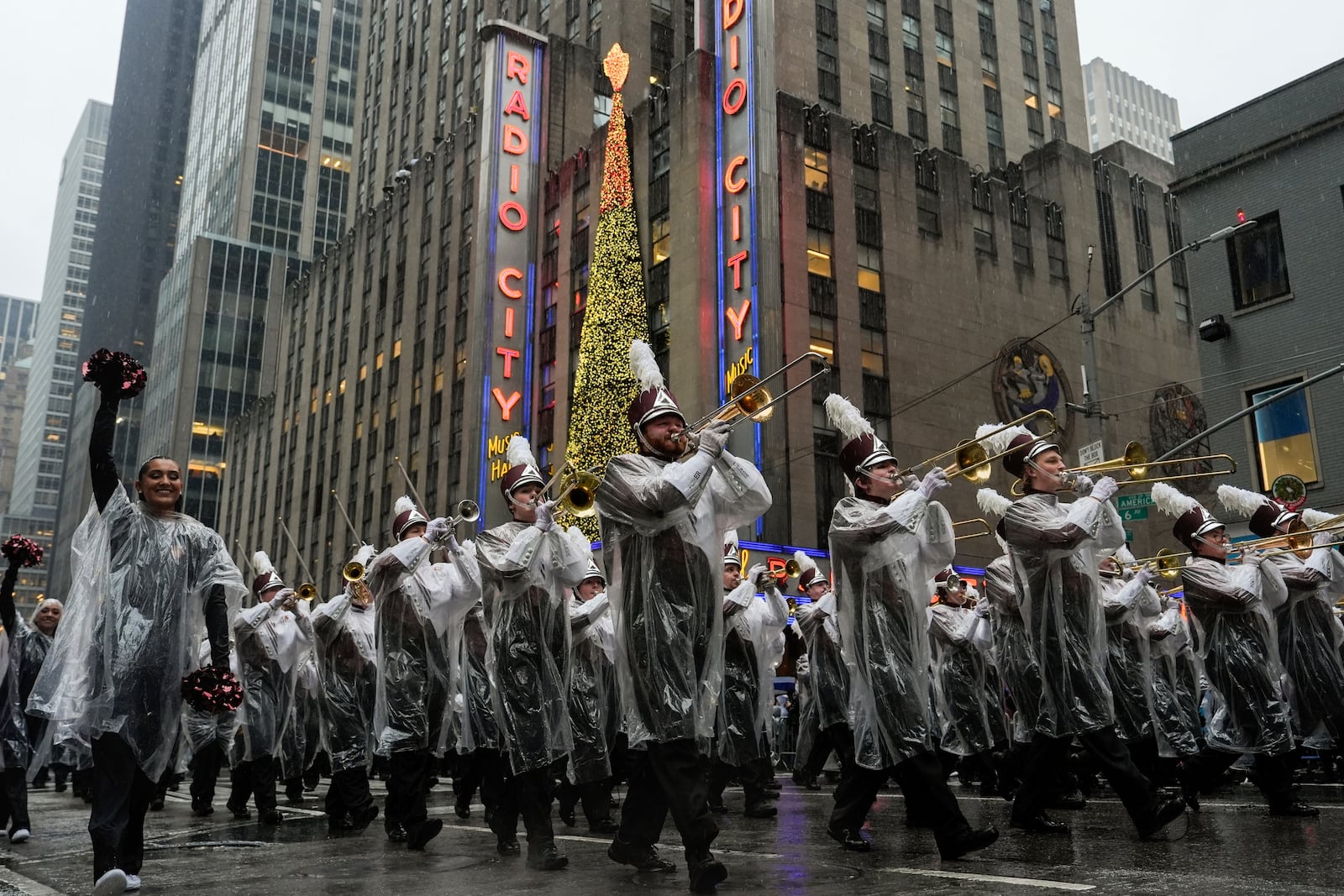 The University of Massachusetts Minutemen marching band plays as it makes its way down Central Park West while participating in the Macy's Thanksgiving Day Parade, Thursday, Nov. 28, 2024, in New York. (AP Photo/Julia Demaree Nikhinson)