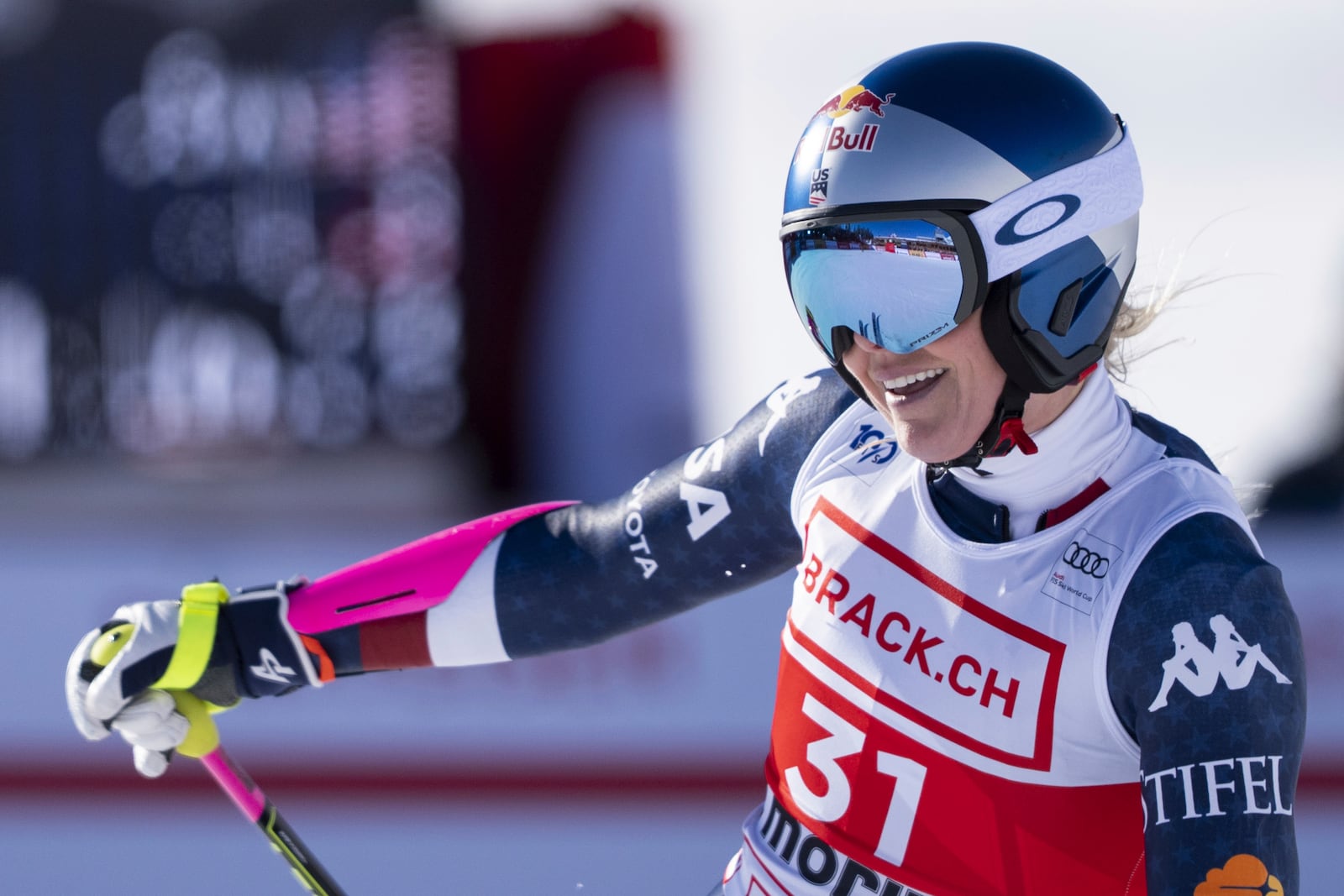 United States' Lindsey Vonn, right, smiles after completing an alpine ski, women's World Cup super G, in St. Moritz, Switzerland, Saturday, Dec. 21, 2024. (Til Buergy/Keystone via AP)