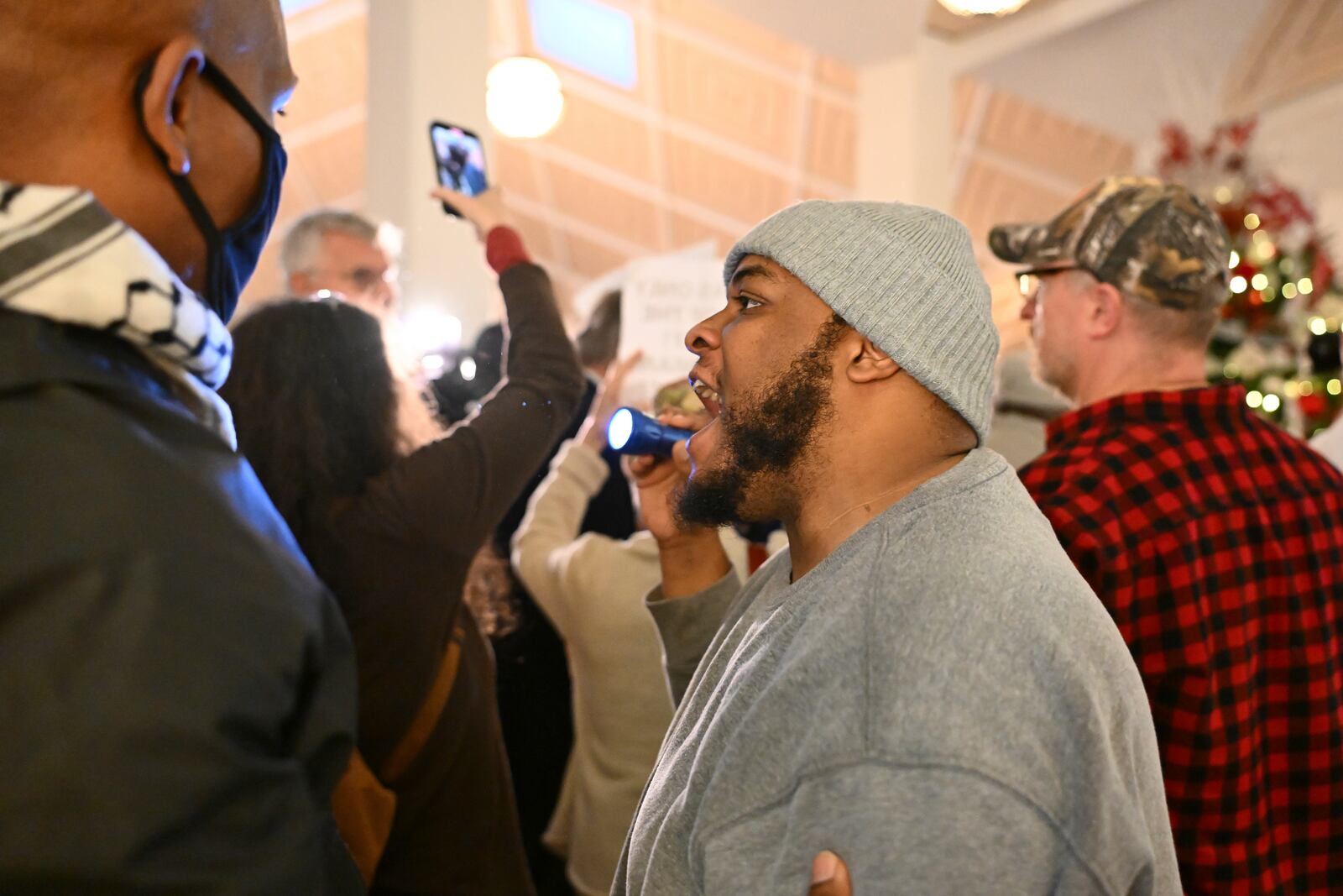 A protestor reacts as the Republican-dominated North Carolina House convened to complete the override of Democratic Gov. Roy Cooper's veto of a bill that aims to weaken the powers of Cooper's soon-to-be successor and other Democratic statewide winners in the Nov. 5 elections, Wednesday, Dec. 11, 2024, in Raleigh, N.C. (AP Photo/Matt Kelley)