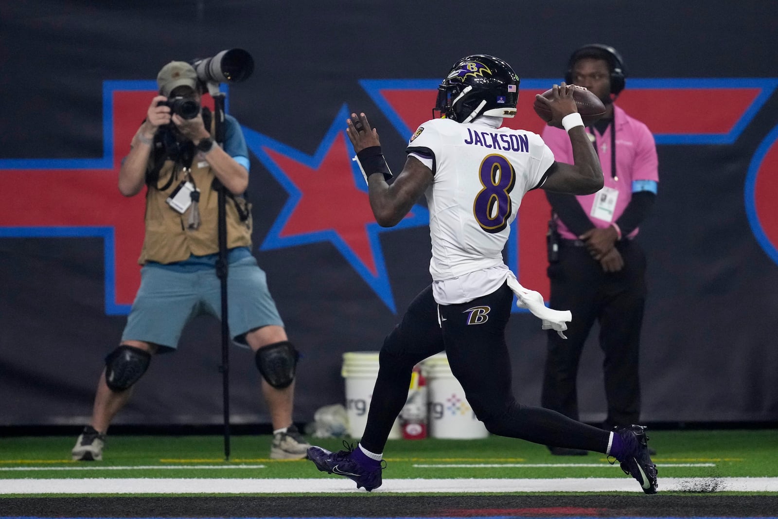 Baltimore Ravens quarterback Lamar Jackson (8) celebrates after a 48-yard touchdown run during the second half of an NFL football game against the Houston Texans, Wednesday, Dec. 25, 2024, in Houston. (AP Photo/David J. Phillip)