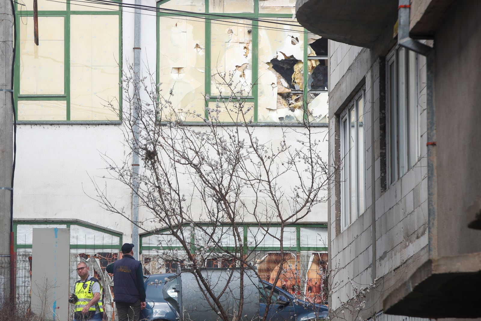 Police officers investigate a nightclub after a massive fire in the town of Kocani, North Macedonia, Sunday, March 16, 2025. (AP Photo/Boris Grdanoski)