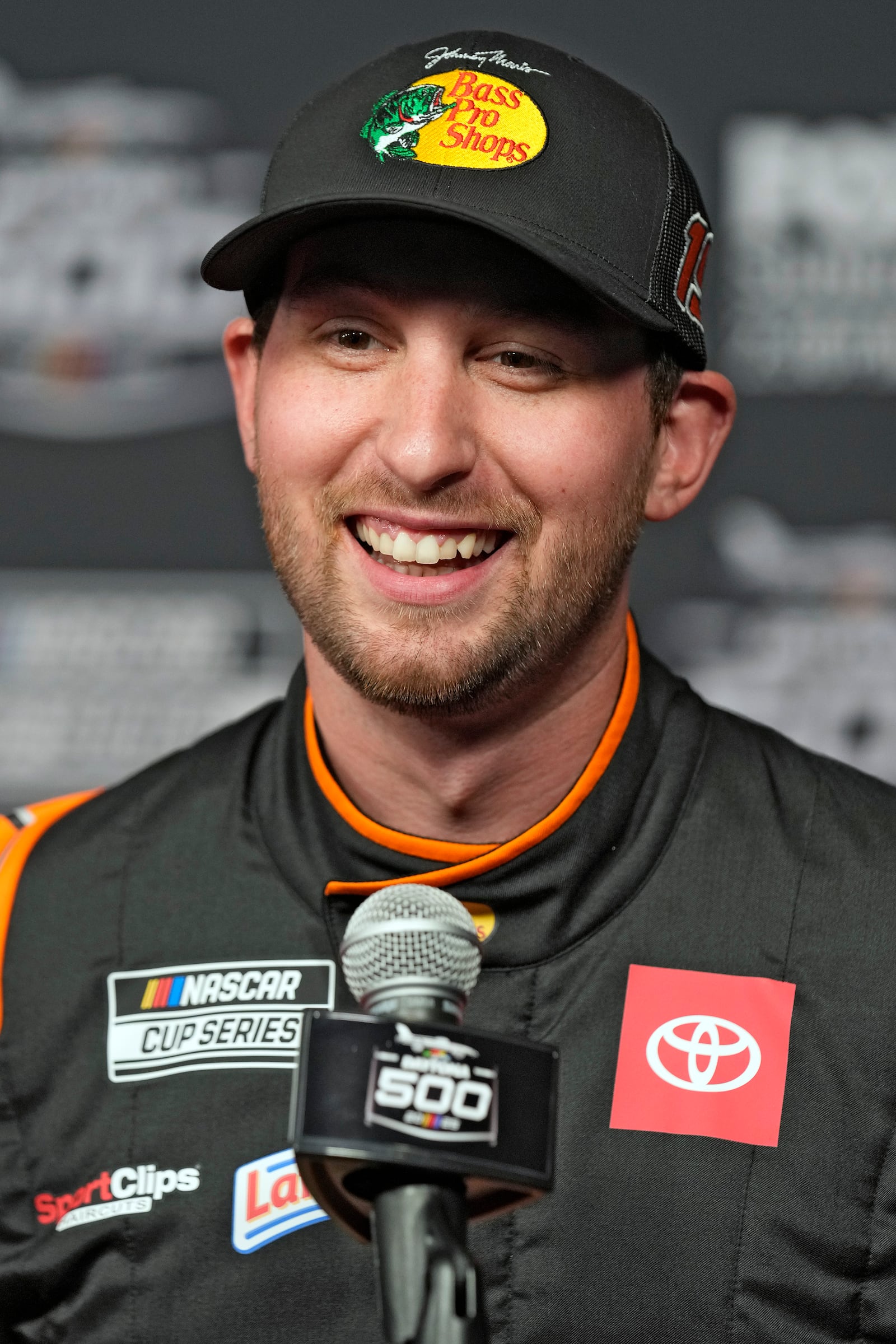 Chase Briscoe smiles as he speaks to reporters during the NASCAR Daytona 500 auto racing media day Wednesday, Feb. 12, 2025, at Daytona International Speedway in Daytona Beach, Fla. (AP Photo/Chris O'Meara)