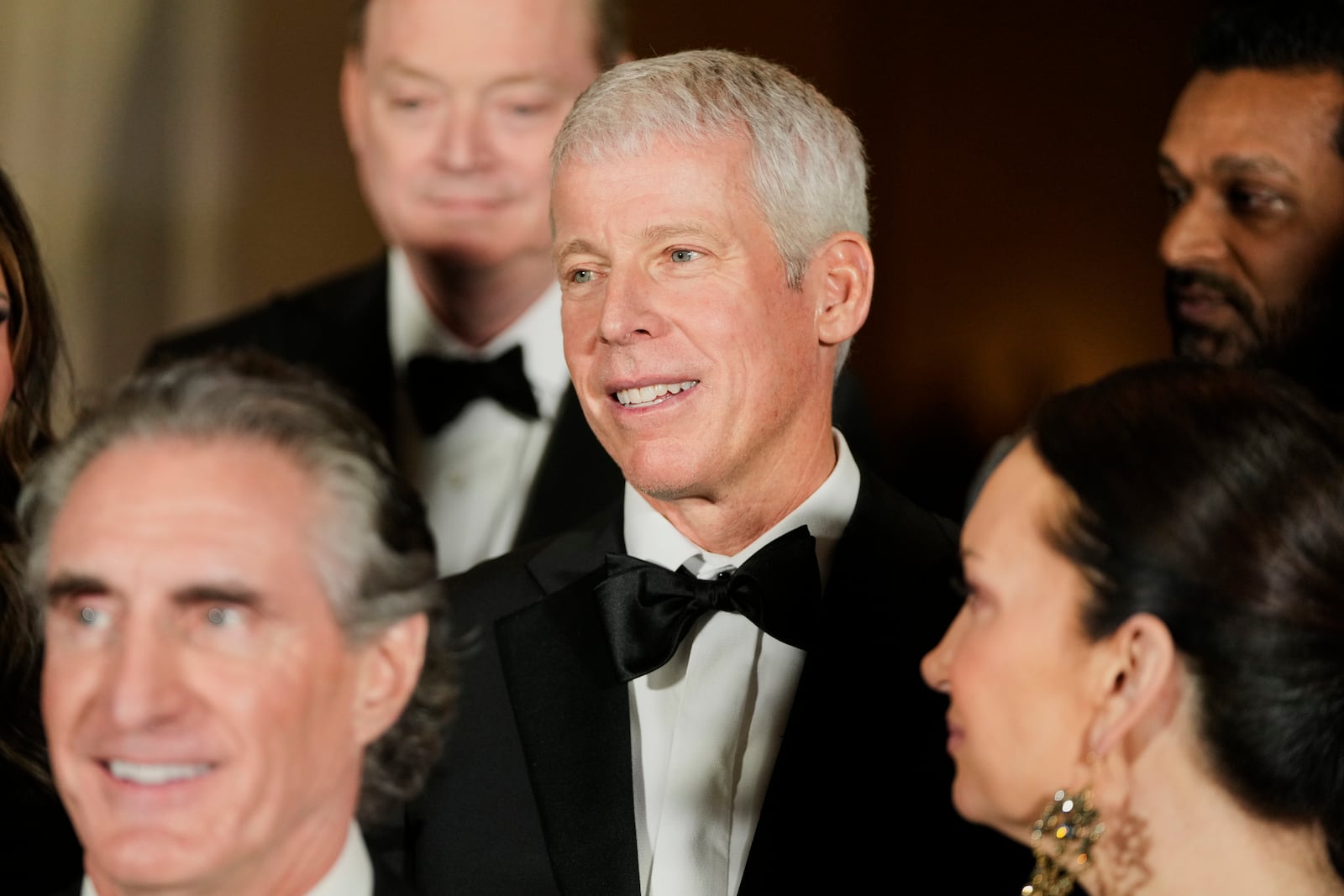 Chris Wright, President-elect Donald Trump's nominee to be Secretary of Energy, poses for a photo with Cabinet picks, other nominees and appointments, at the National Gallery of Art in Washington, Saturday, Jan. 18, 2025. (AP Photo/Mark Schiefelbein)