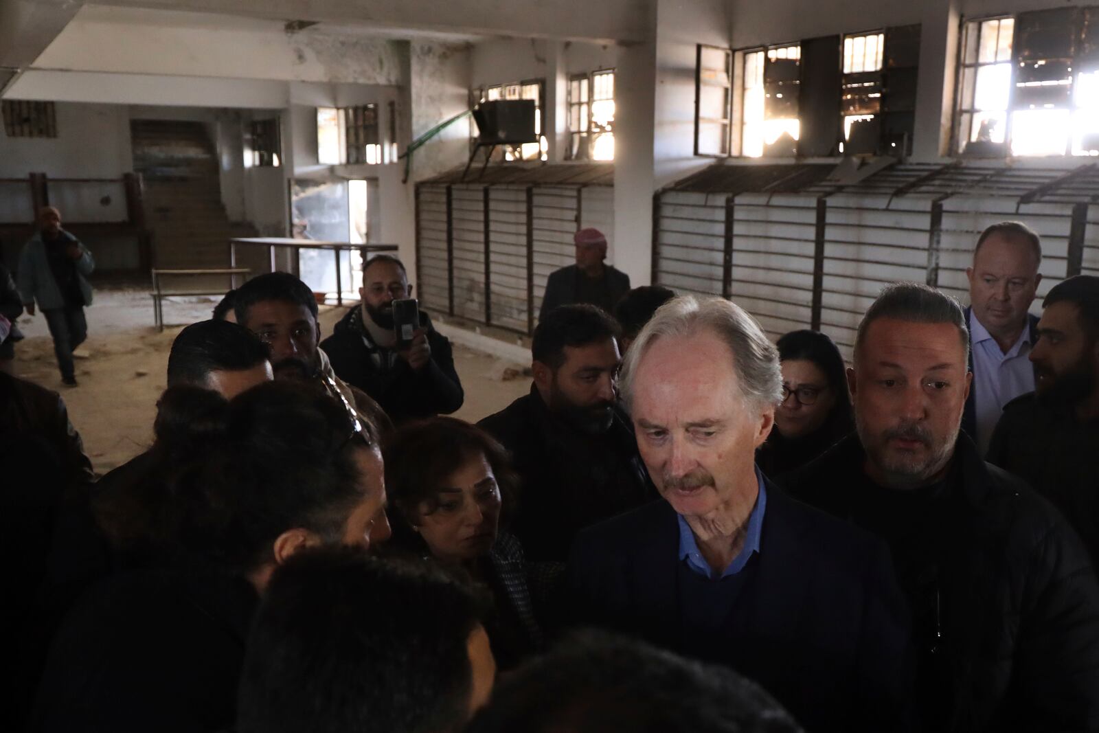 Geir Pedersen, the United Nations' special envoy to Syria, centre, visits the infamous Saydnaya military prison, in Saydnaya north of Damascus, Syria, Monday, Dec. 16, 2024. (AP Photo/Omar Albam)