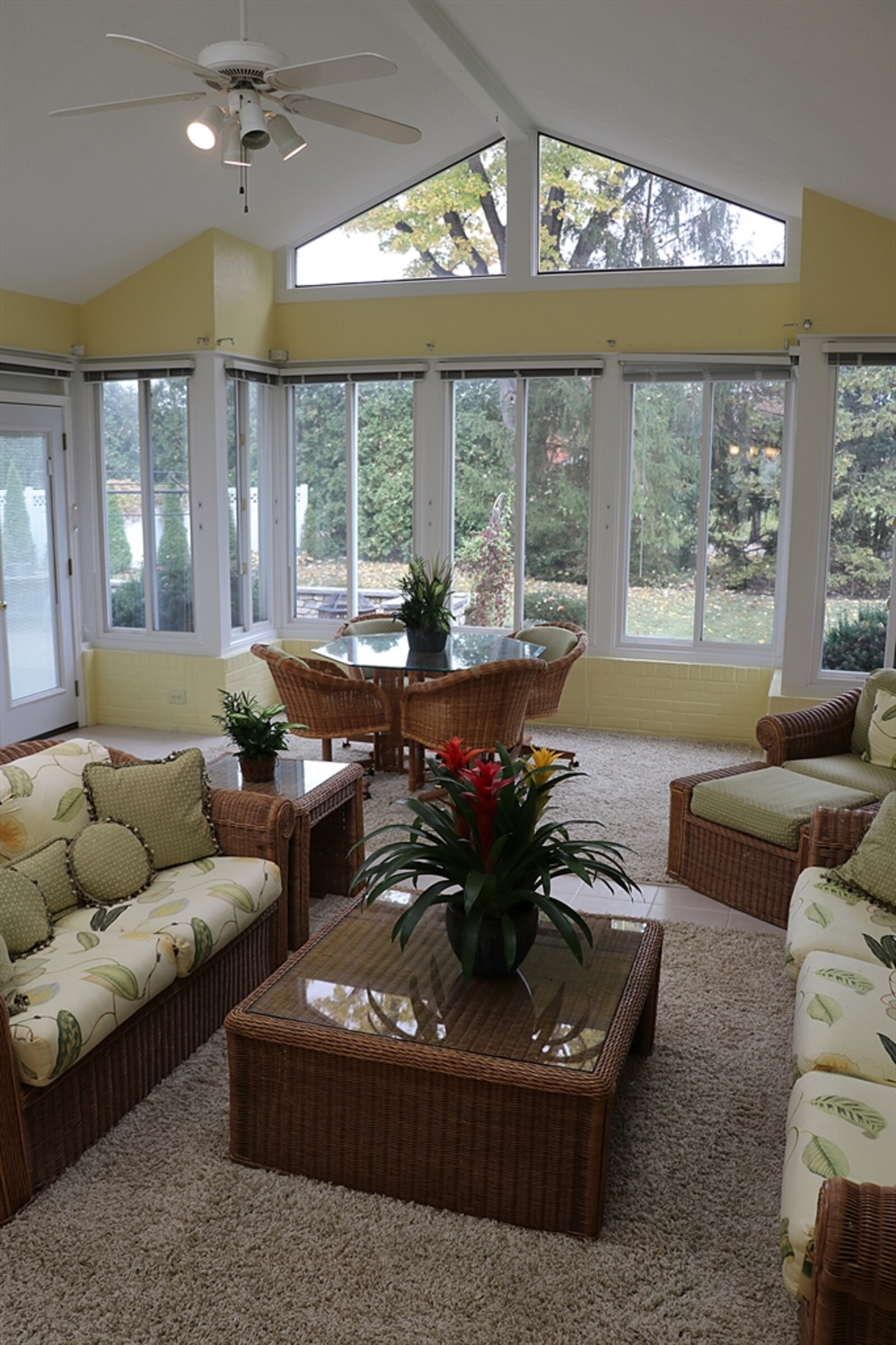 Oversized sliding patio doors open from the family room out to the four-season room, which is also accessible from the breakfast room.