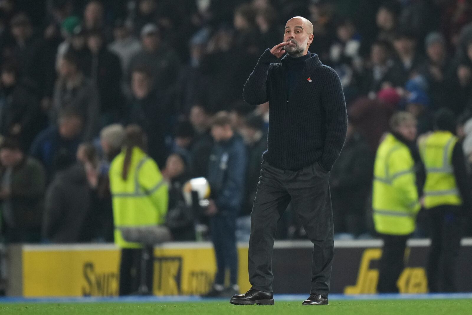 Manchester City's head coach Pep Guardiola stands after the English Premier League soccer match between Brighton and Manchester City at Falmer Stadium in Brighton, England, Saturday, Nov. 9, 2024. (AP Photo/Alastair Grant)