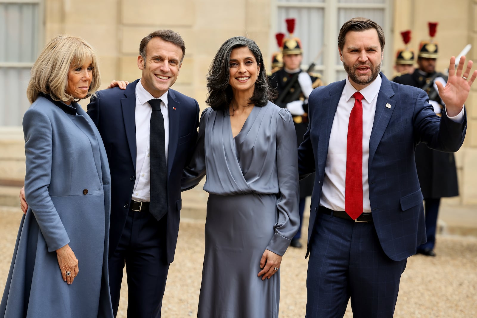 French President Emmanuel Macron, second left, and Brigitte Macron, left, pose for a group photo with United States Vice-President JD Vance and second lady Usha Vance during arrivals for a working lunch at the Elysee Palace during an event on the sidelines of the Artificial Intelligence Action Summit in Paris, Tuesday, Feb. 11, 2025. (AP Photo/Thomas Padilla)