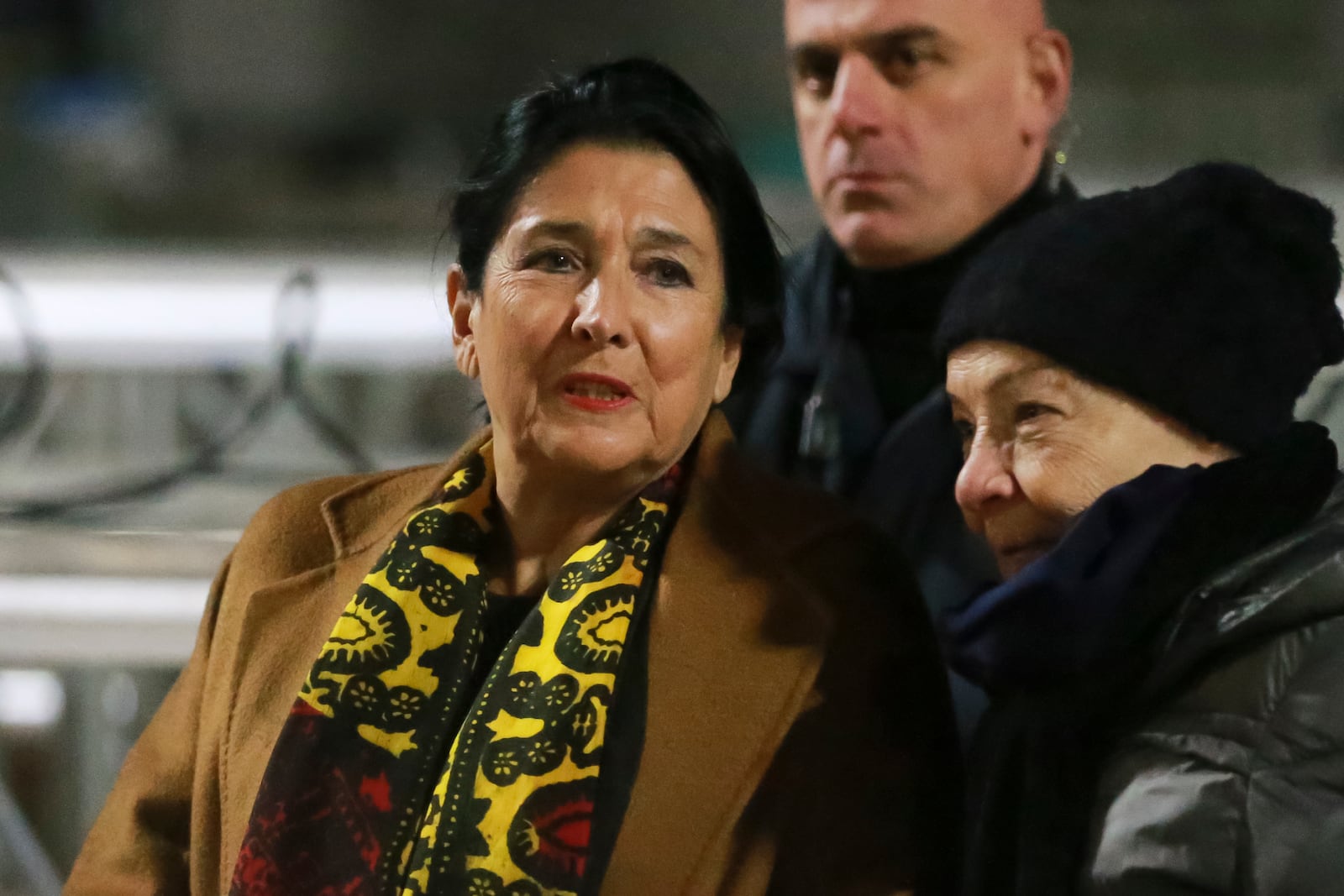 Georgian President Salome Zourabichvili, left, attends an anti-government rally outside the Parliament building in Tbilisi, Georgia, on Saturday, Dec. 14, 2024. (AP Photo/Zurab Tsertsvadze)