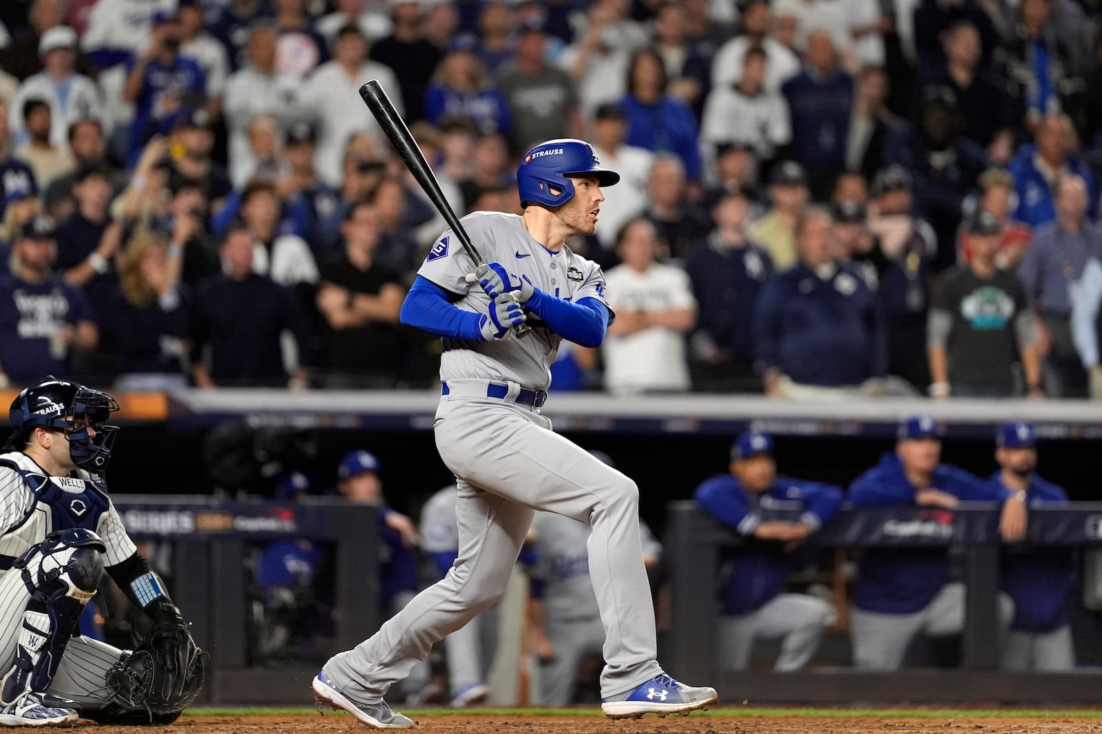 Los Angeles Dodgers' Freddie Freeman watches his two-run single against the New York Yankees during the fifth inning in Game 5 of the baseball World Series, Wednesday, Oct. 30, 2024, in New York. (AP Photo/Godofredo A. Vásquez)