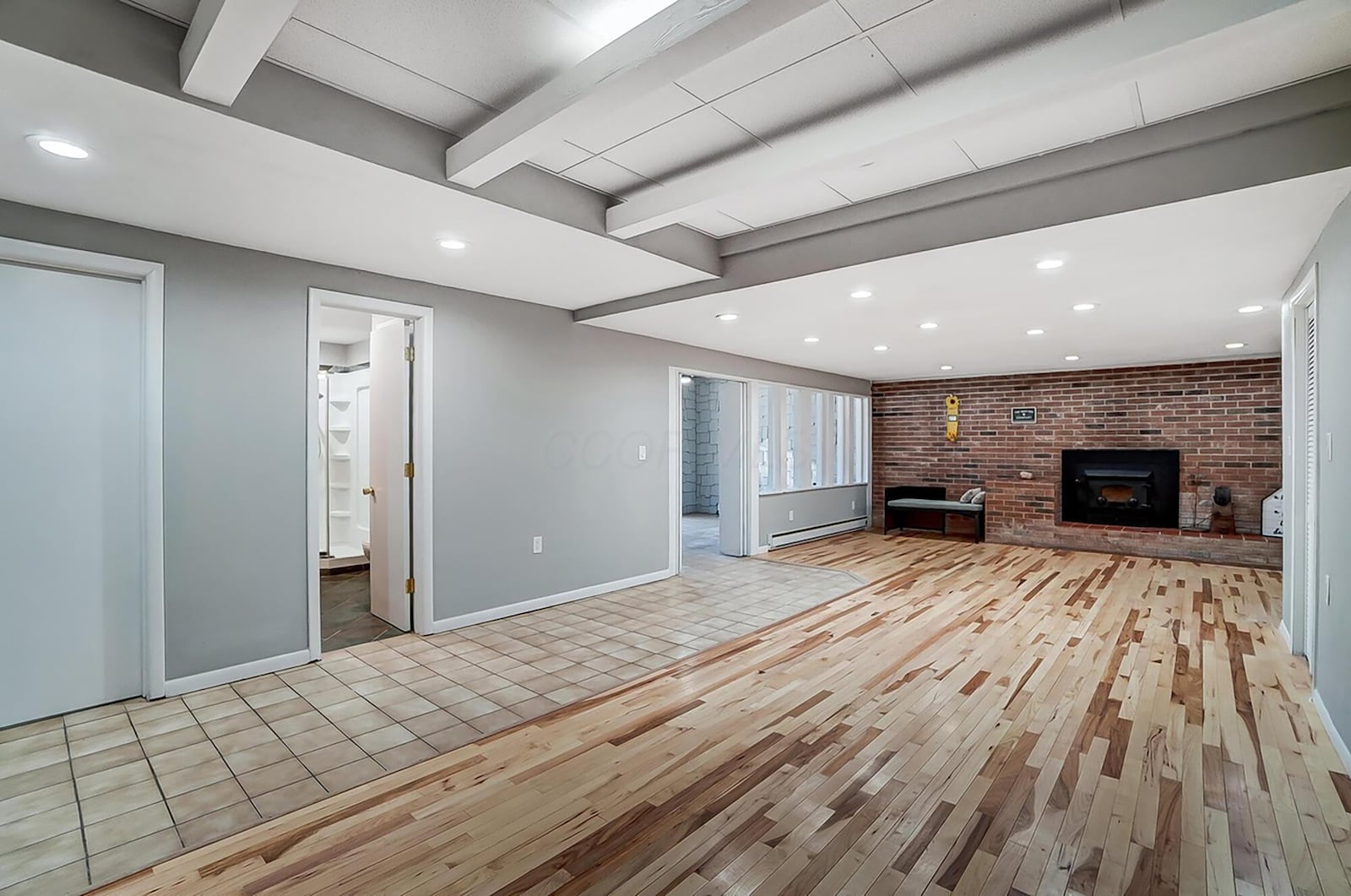 The finished basement features a family room with woodburning fireplace.