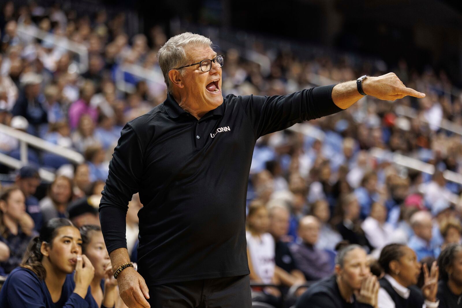 UConn head coach Geno Auriemma directs his team during the first half of an NCAA college basketball game against North Carolina in Greensboro, N.C., Friday, Nov. 15, 2024. (AP Photo/Ben McKeown)