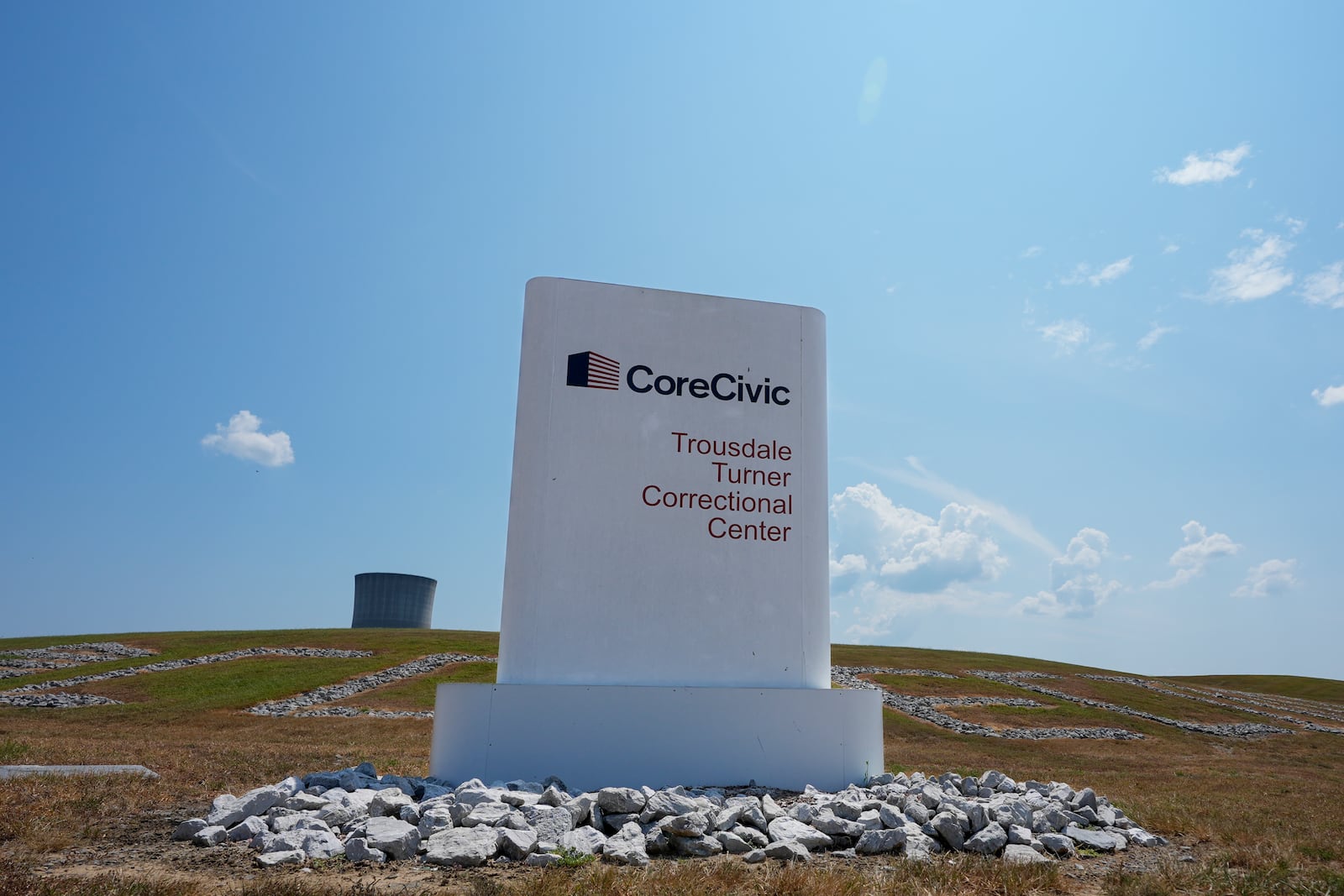 A sign outside Trousdale Turner Correctional Center operated by CoreCivic is seen Thursday, Aug. 29, 2024, in Hartsville, Tenn. (AP Photo/George Walker IV)