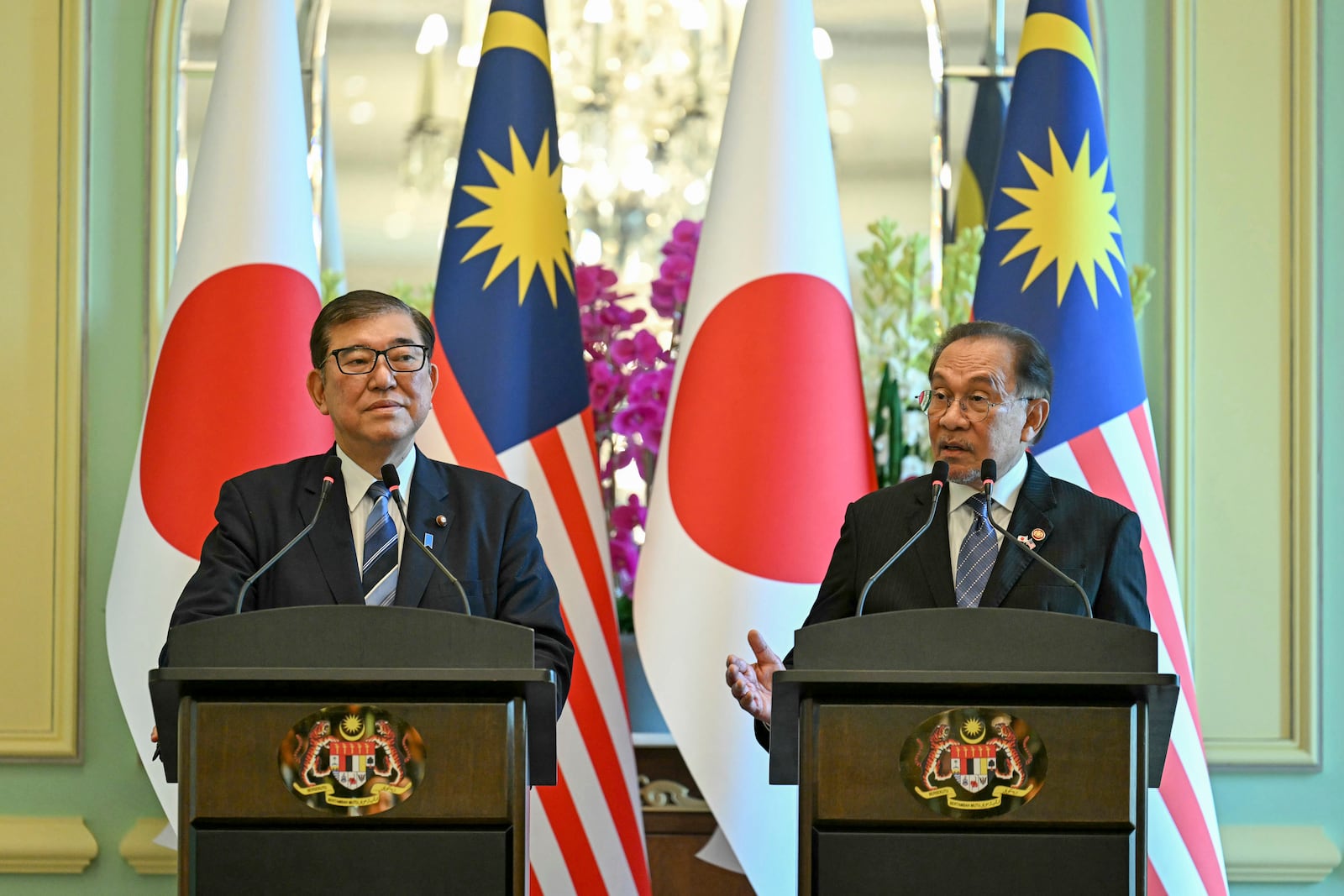 Malaysia's Prime Minister Anwar Ibrahim, right, and Japan's Prime Minister Shigeru Ishiba attend a joint press conference at the prime minister's office in Putrajaya, Malaysia, Friday, Jan. 10, 2025. (Mohd Rasfan/Pool Photo via AP)