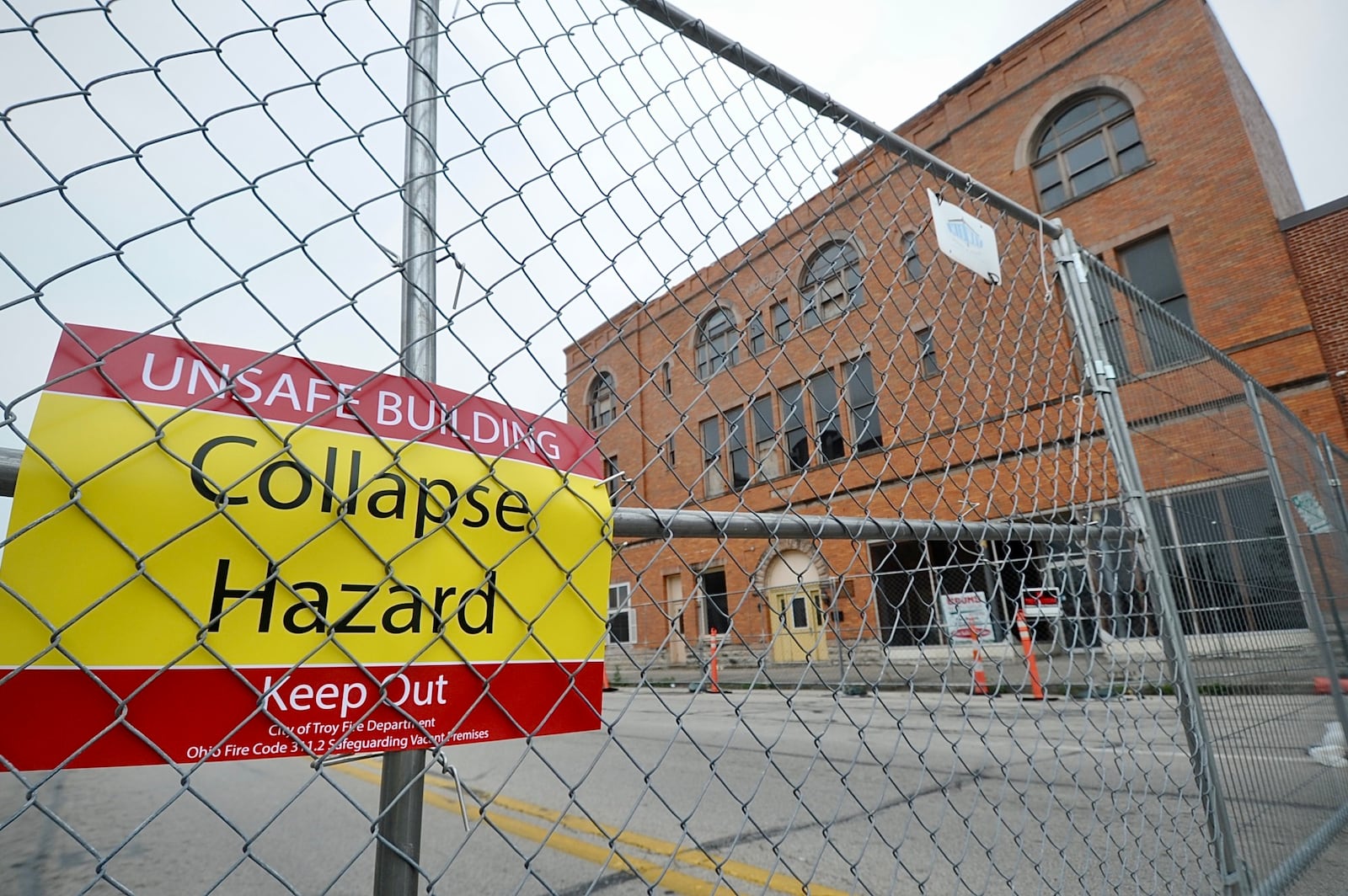 The 100 block of West Main Street in Troy is completely blocked off June 27, 2023, after city officials declared the controversial Tavern building there unsafe. MARSHALL GORBY \STAFF