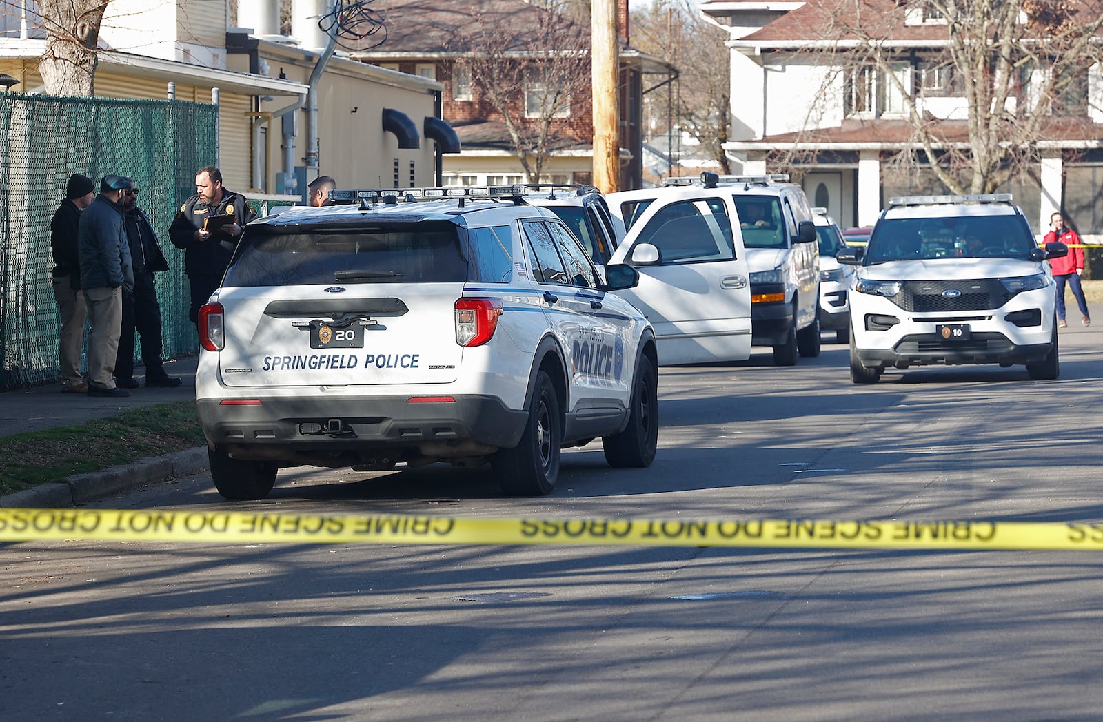 The Springfield Police Division investigate near a Chevy Tahoe, parked along Mason Street, where a man was found with a suspected gunshot wound to the head Tuesday, Feb. 6, 2024. BILL LACKEY/STAFF