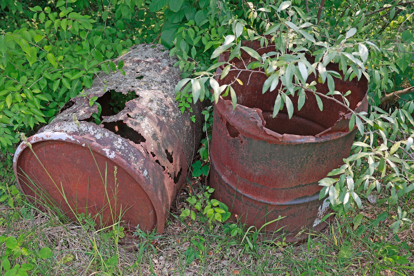 Old, rusted barrels at the Tremont City Barrel Fill Wednesday, June 7, 2023. The barrels contain water from groundwater sampling that was conducted in 2014, according to the EPA. That groundwater was determined to have no significant contamination. BILL LACKEY/STAFF