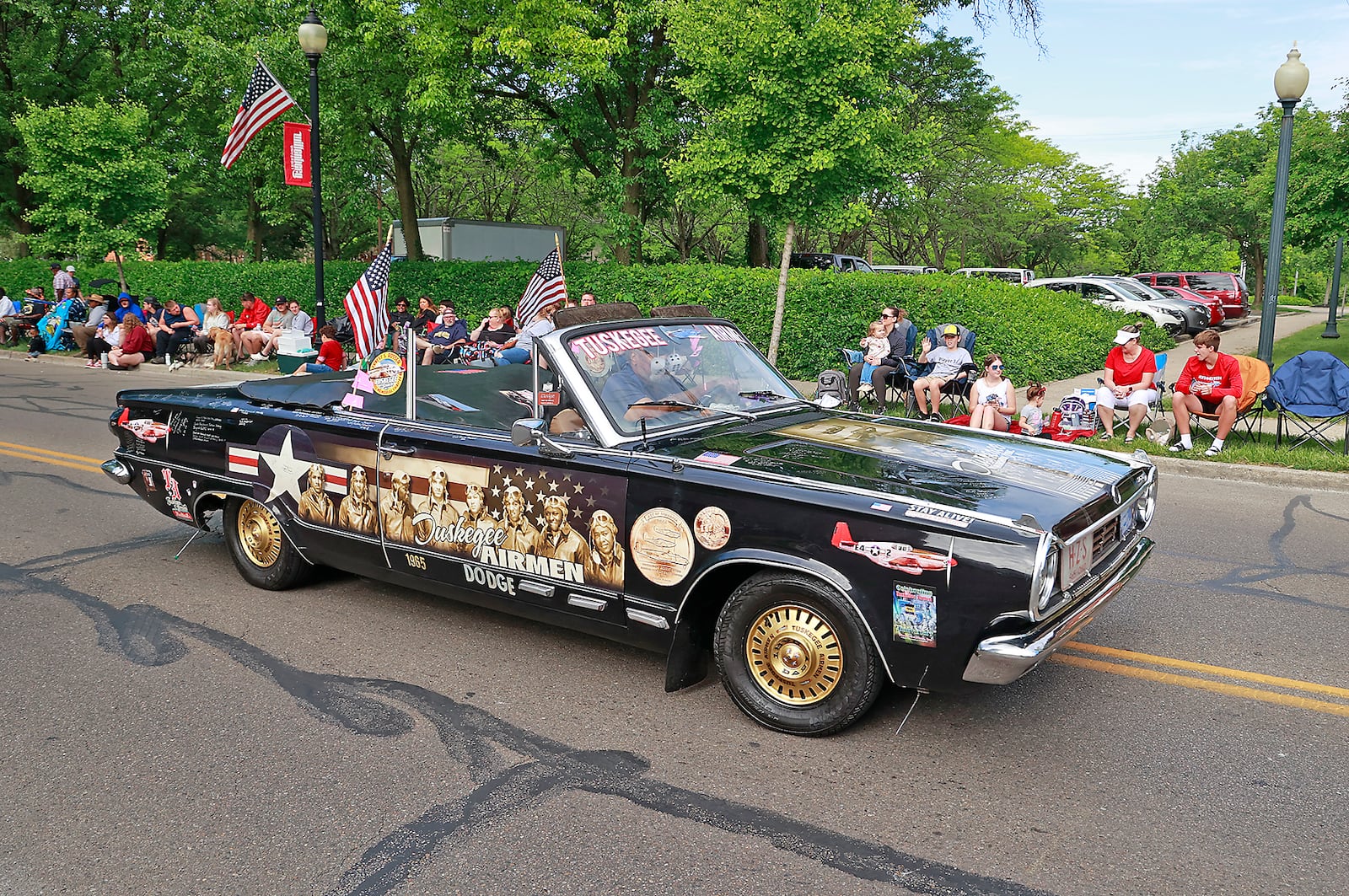 Thousands of people lined the parade route in their red, white and blue regalia to watch the 2023 Springfield Memorial Day Monday, May 29, 2023. The parade, which featured floats, fire trucks and bands, began with the throwing of the ceremonial wreath into Buck Creek and the somber sound of TAPS playing to honor those who haven given their all in service to our country. BILL LACKEY/STAFF