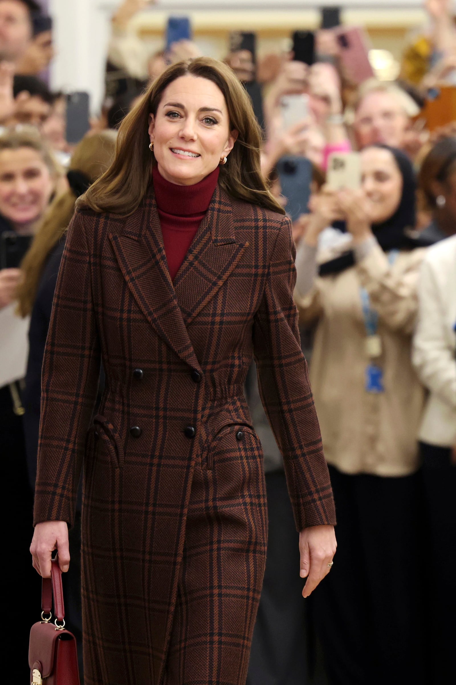 Britain's Princess Kate walks during a visit to The Royal Marsden Hospital, where she received her cancer treatment, in London, Tuesday Jan. 14, 2025 in London, England. (Chris Jackson/Pool Photo via AP)