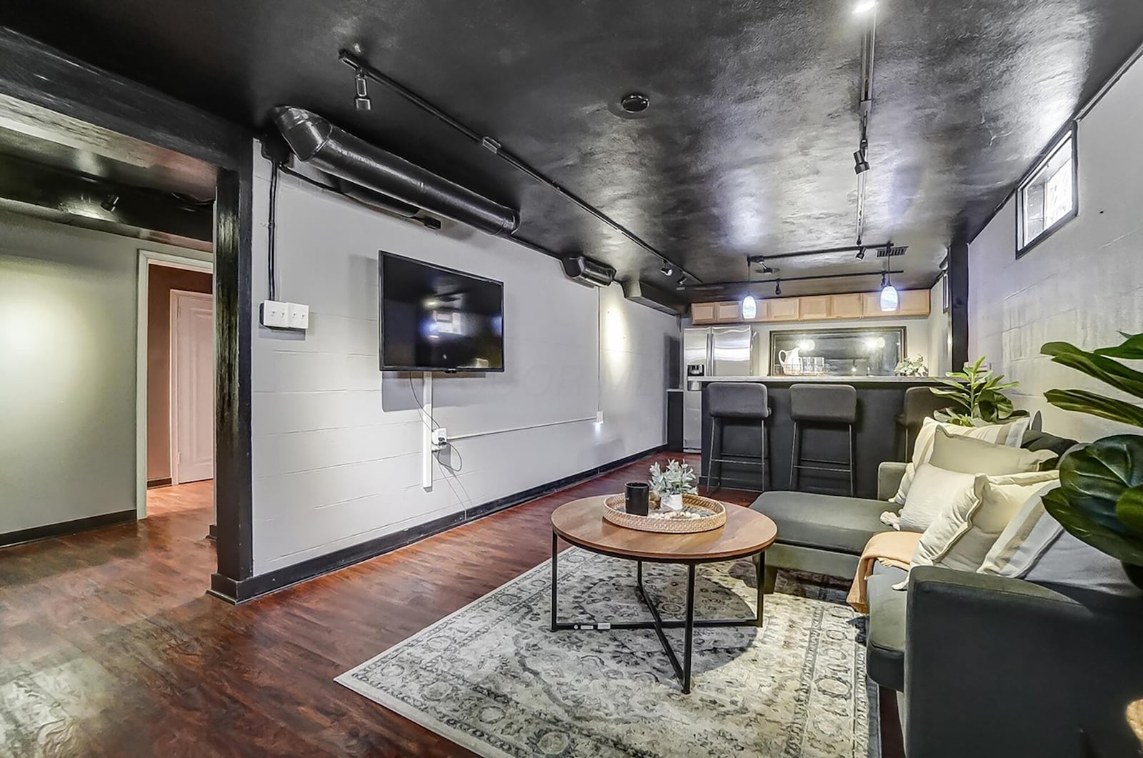 The finished basement has a recreation room with a wet bar/kitchenette.