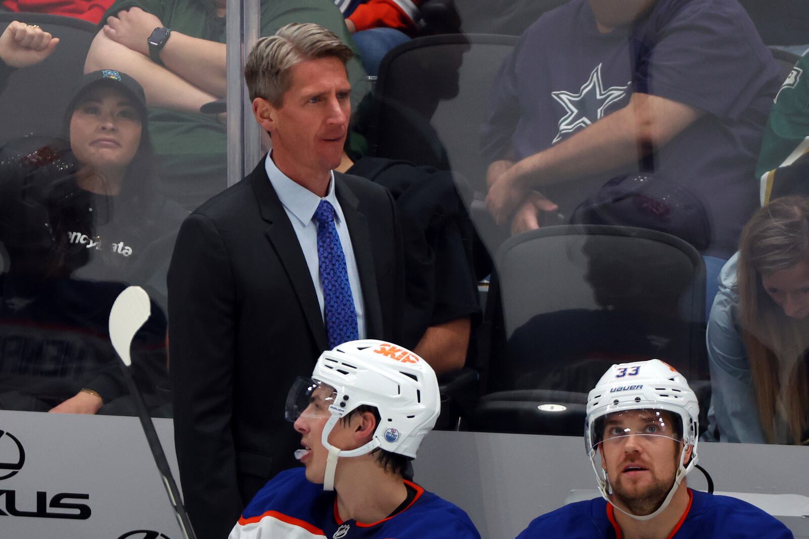 Edmonton Oilers head coach Kris Knoblauch stands behind the team bench in the third period during an NHL hockey game against the Dallas Stars, Saturday, Oct. 19, 2024, in Dallas. (AP Photo/Richard W. Rodriguez)