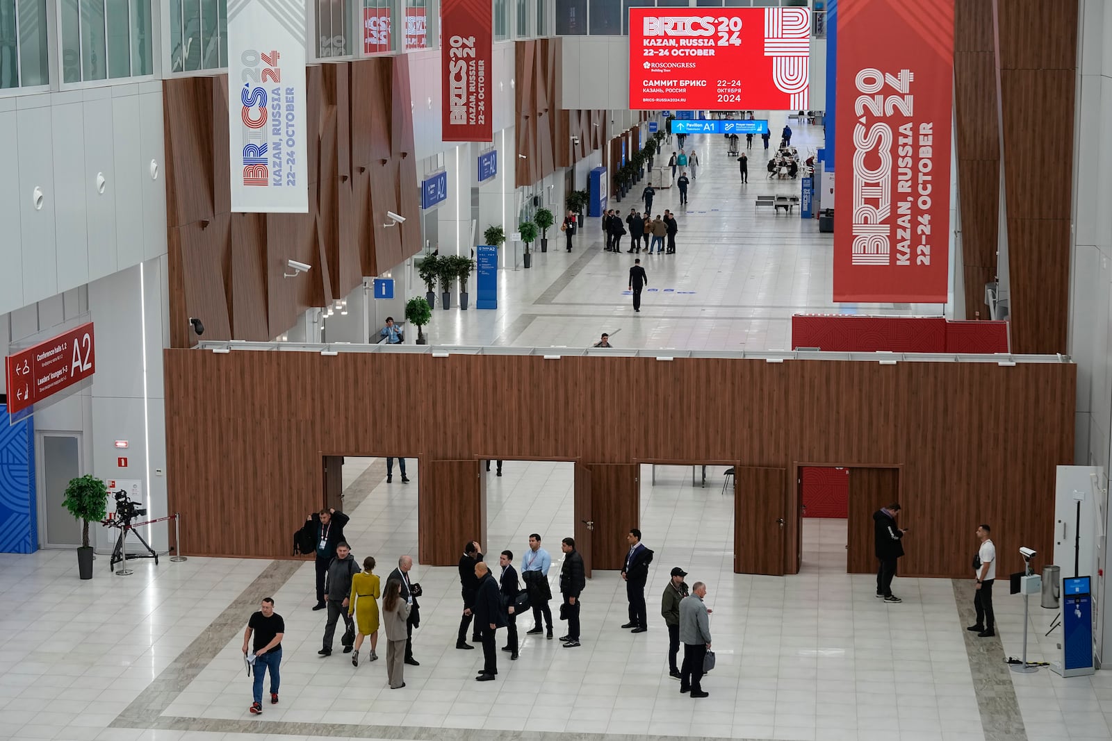 People walk at Kazan Expo the day before BRICS Summit in Kazan, Russia, Monday, Oct. 21, 2024. (AP Photo/Alexander Zemlianichenko)