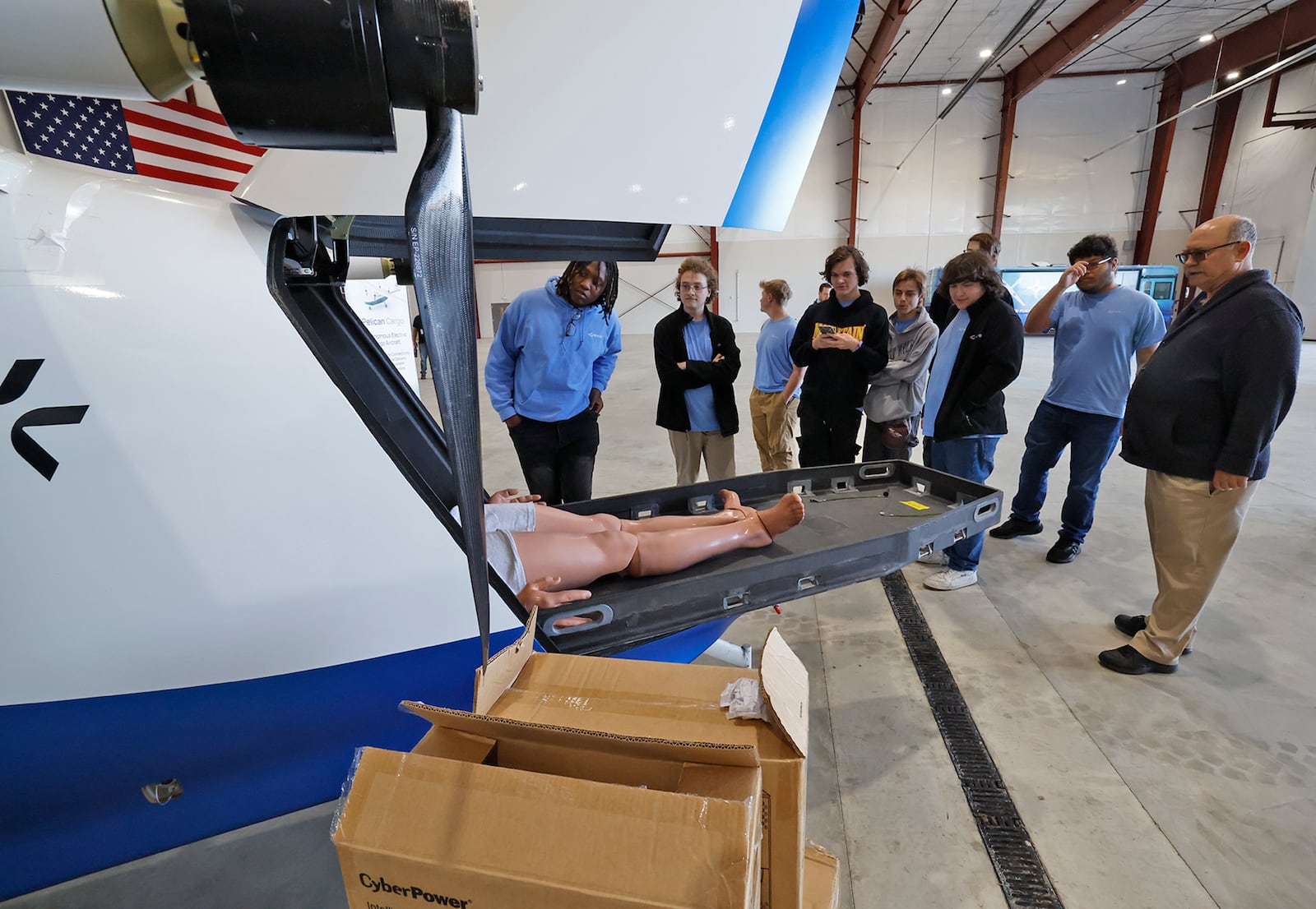 A group of students from the Greene County Career Center look over a PYKA UAV at the National Advanced Air Mobility Center of Excellence Monday, Sept. 9, 2024. BILL LACKEY/STAFF