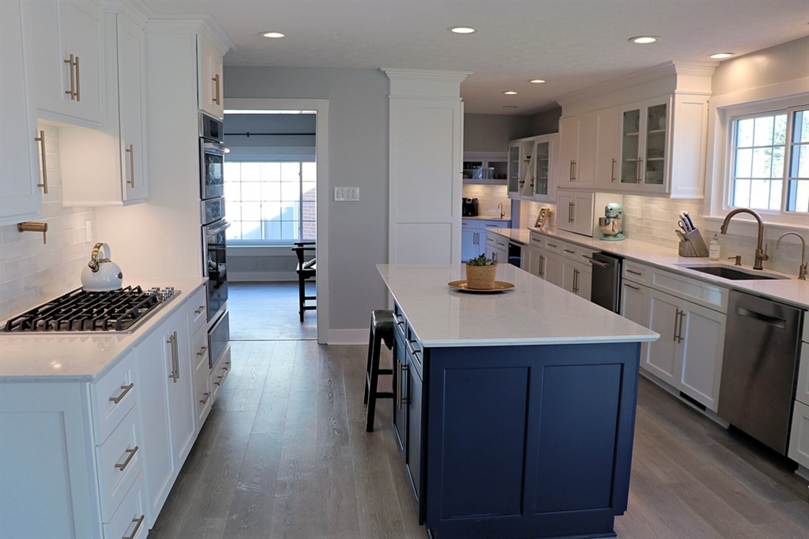 The remodeled kitchen and breakfast room include walls of cabinetry and Cambria quartz counters. 