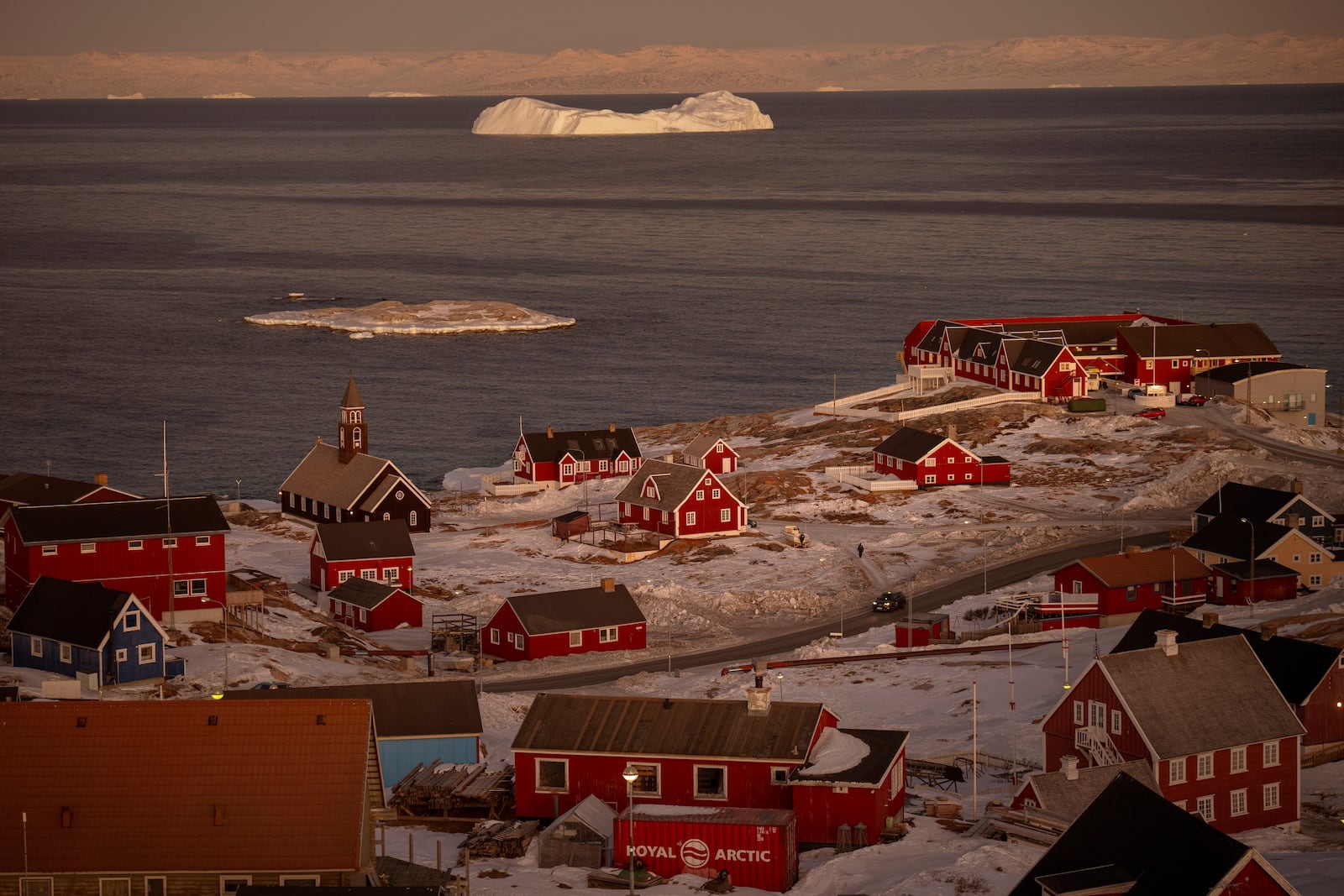 An iceberg is visible near the city of Ilulissat, Greenland, Wednesday Feb.19, 2025. (AP Photo/Emilio Morenatti)