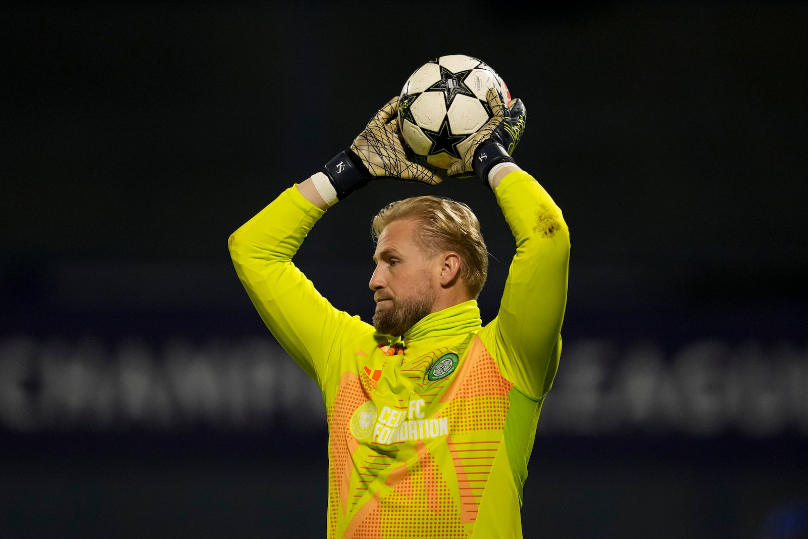 Celtic's goalkeeper Kasper Schmeichel catches the ball during the Champions League opening phase soccer match between Dinamo Zagreb and Celtic, at Maksimir stadium in Zagreb, Croatia, Tuesday, Dec. 10, 2024. (AP Photo/Darko Vojinovic)