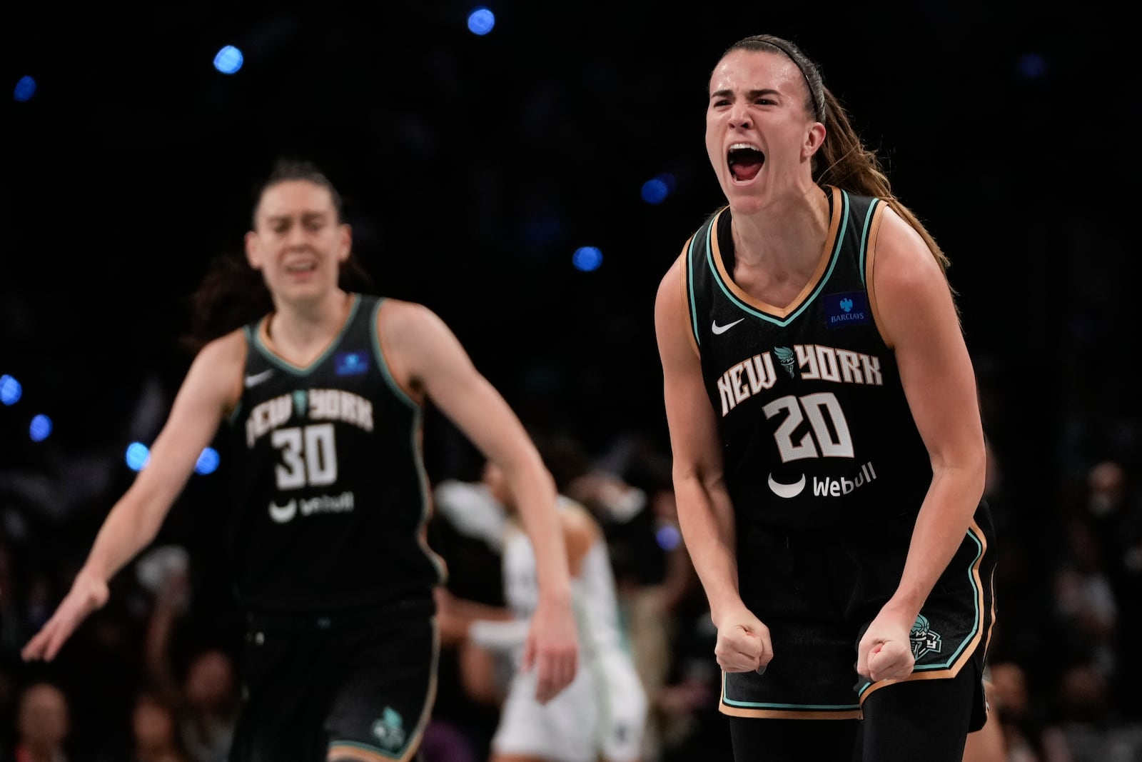 New York Liberty guard Sabrina Ionescu (20) reacts after scoring against the Minnesota Lynx during the third quarter of Game 5 of the WNBA basketball final series, Sunday, Oct. 20, 2024, in New York. (AP Photo/Pamela Smith)