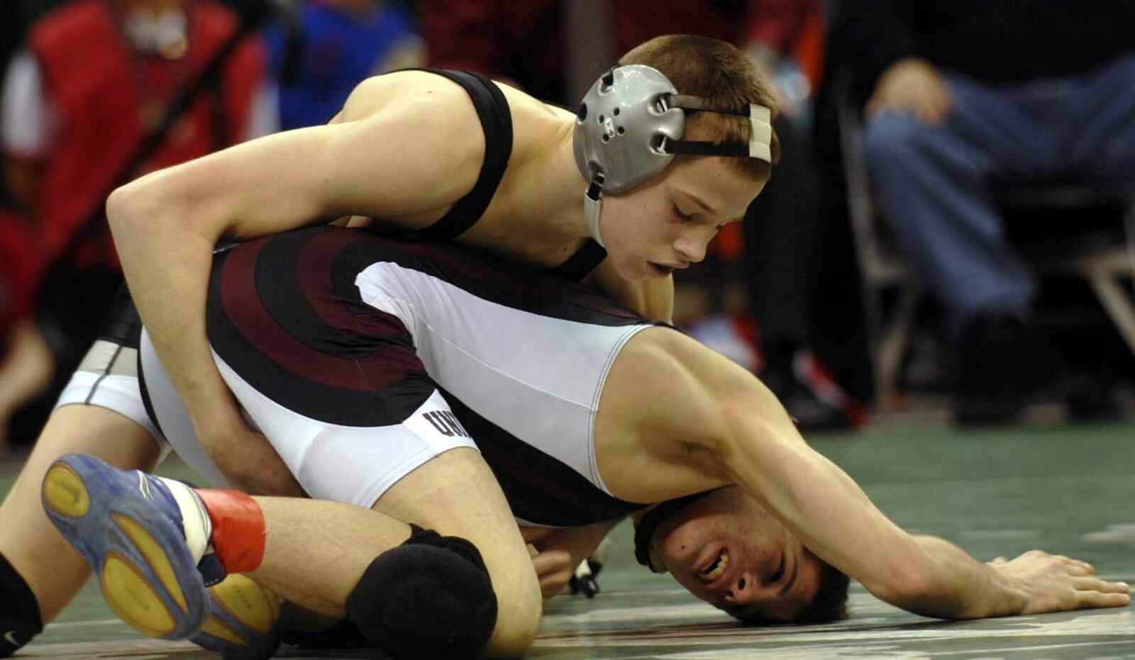 Graham's David Taylor wrestles James Inghram of Hunting Valley University School Saturday during their Division II state championship match. Staff photo by Bill Lackey