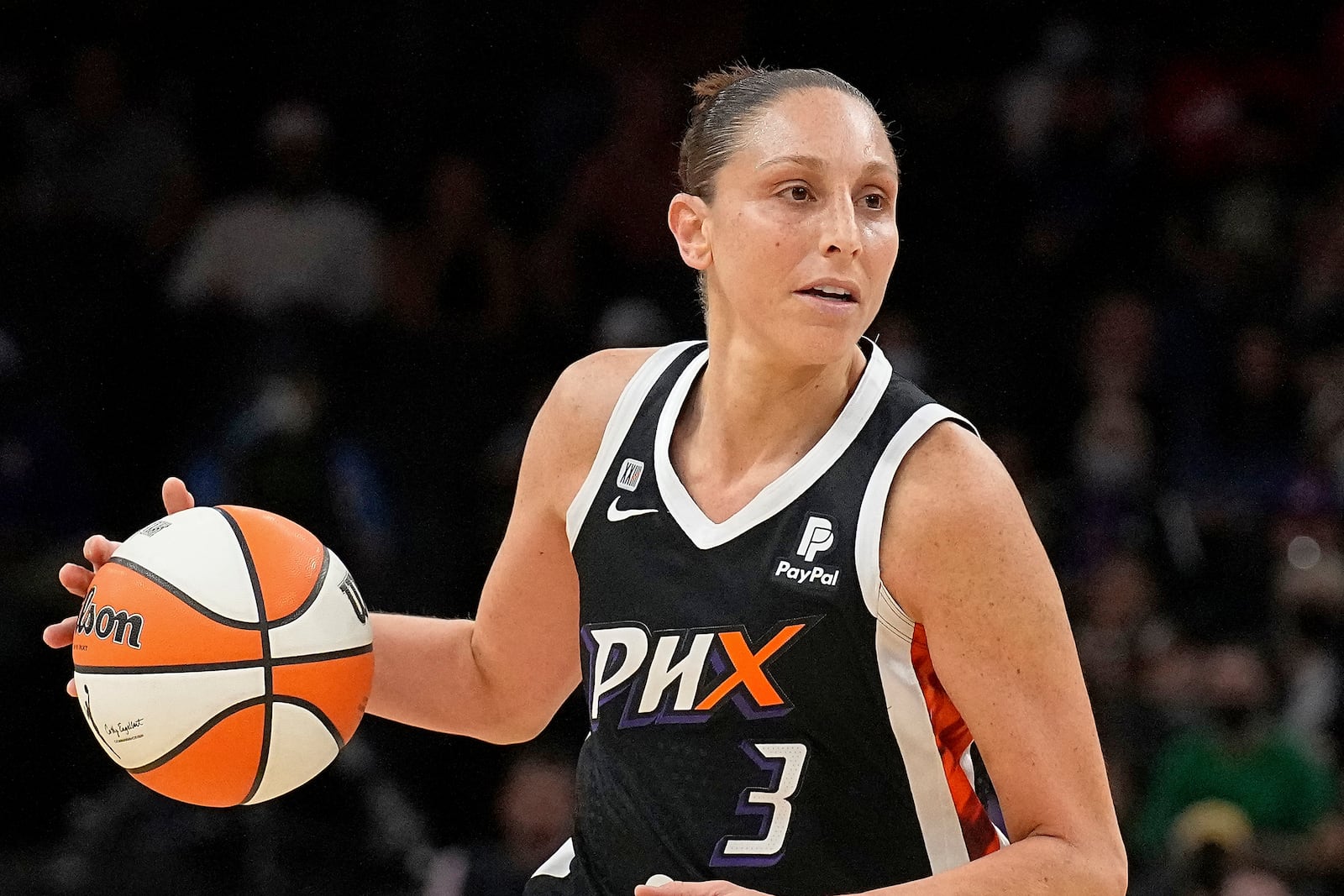 FILE - Phoenix Mercury guard Diana Taurasi (3) dribbles during the first half of Game 2 of basketball's WNBA Finals against the Chicago Sky, Wednesday, Oct. 13, 2021, in Phoenix. (AP Photo/Rick Scuteri, File)