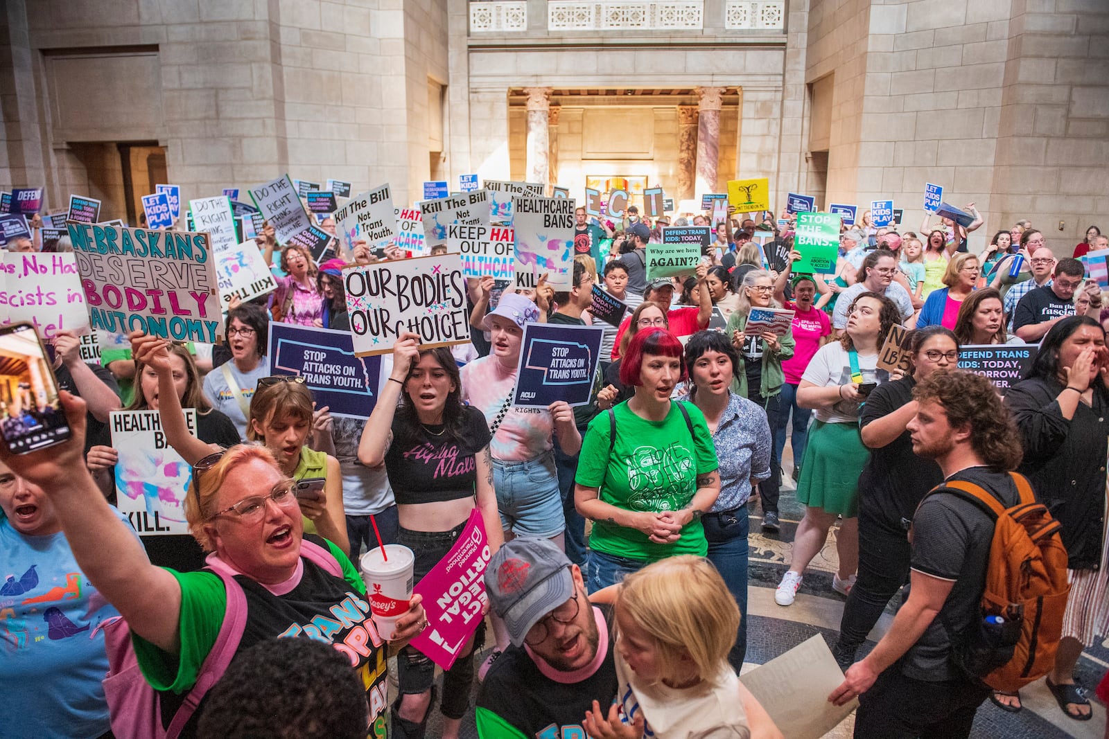 FILE - Protesters chant, "One vote to save our lives," as they are heard in the legislative chamber during a final reading on a bill that combined a 12-week abortion ban with a measure to restrict gender-affirming care for people under 19, May 16, 2023, at state Capitol in Lincoln, Neb. (Kenneth Ferriera/Lincoln Journal Star via AP, File)