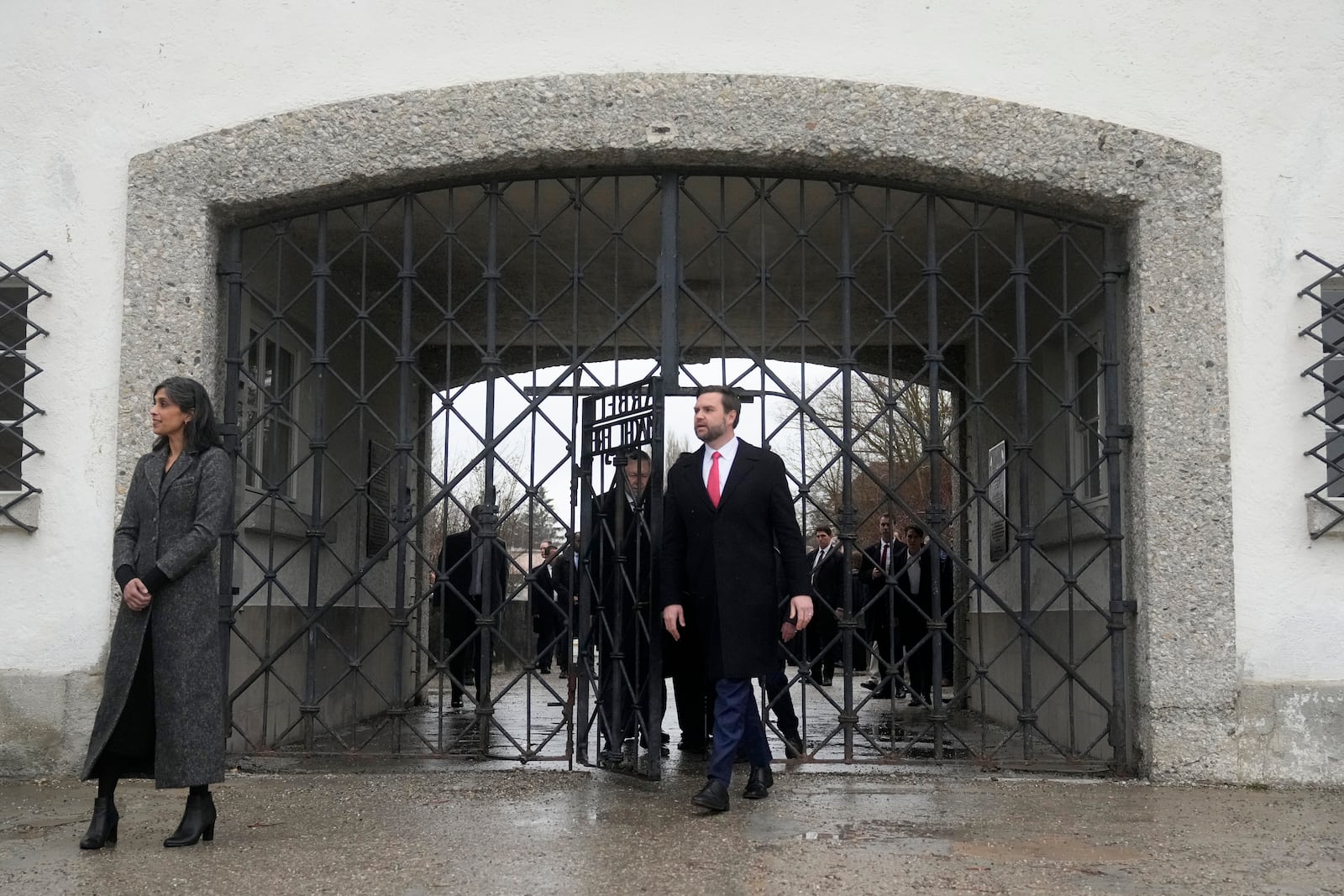 U.S. Vice President JD Vance and second lady Usha Vance enter the Dachau Concentration Camp Memorial Site outside Munich, Germany, Thursday, Feb. 13, 2025. (AP Photo/Matthias Schrader)