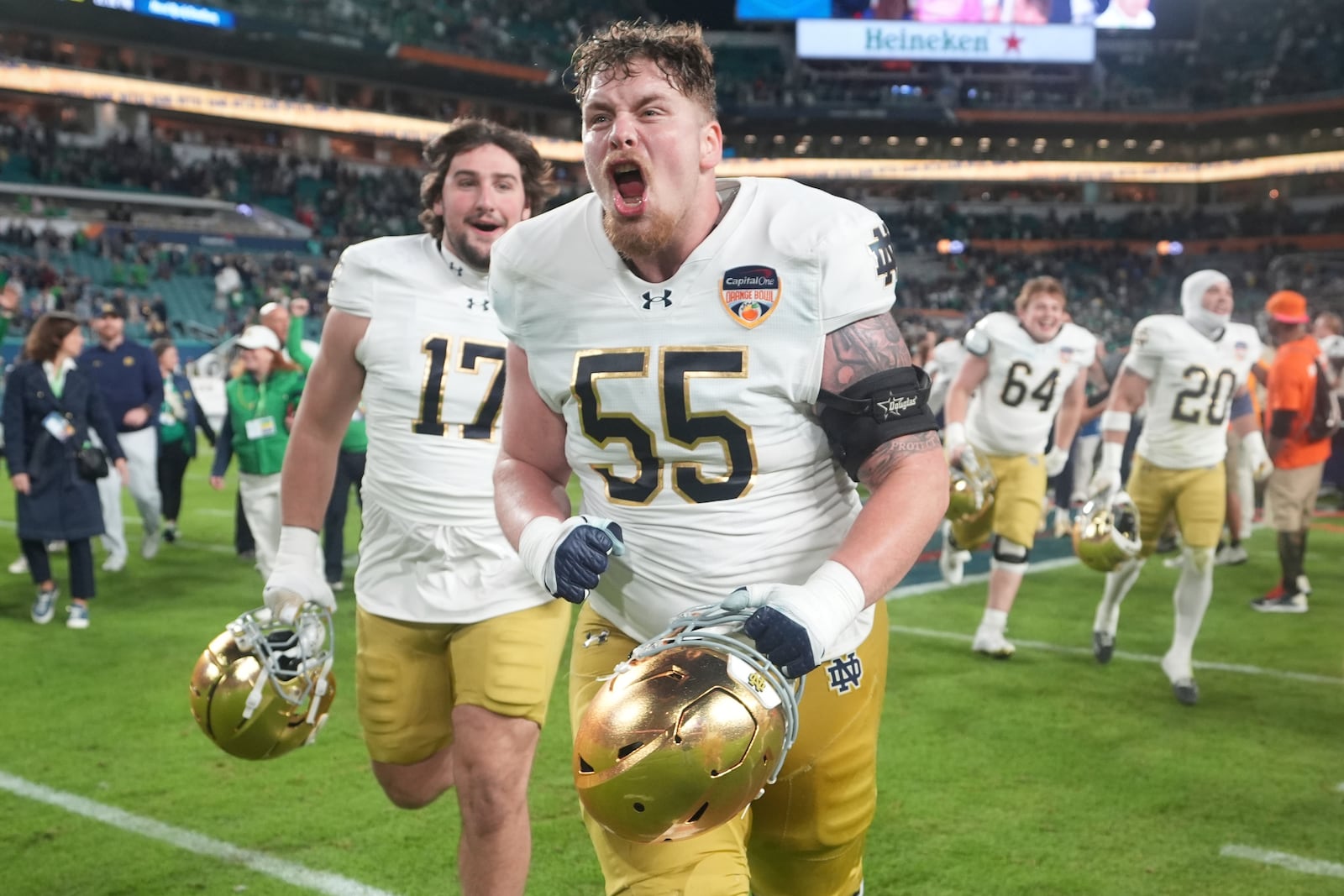 Notre Dame offensive lineman Chris Terek (55) celebrates at the end of the Orange Bowl College Football Playoff semifinal game against Penn State, Thursday, Jan. 9, 2025, in Miami Gardens, Fla. (AP Photo/Lynne Sladky)