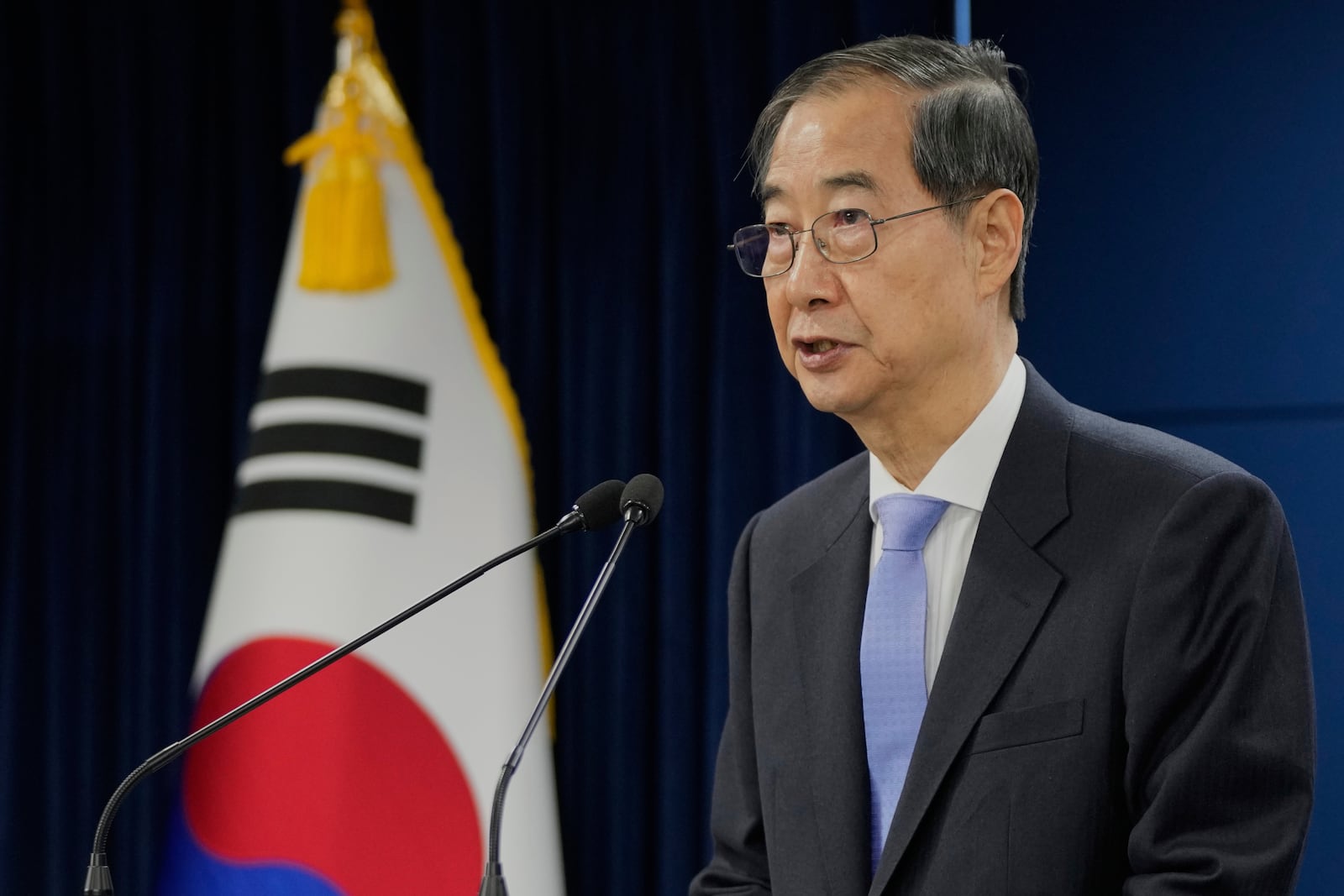 South Korean acting President Han Duck-soo speaks during a briefing at the Government Complex in Seoul, South Korea, Monday, March 24, 2025. (AP Photo/Ahn Young-joon, Pool)