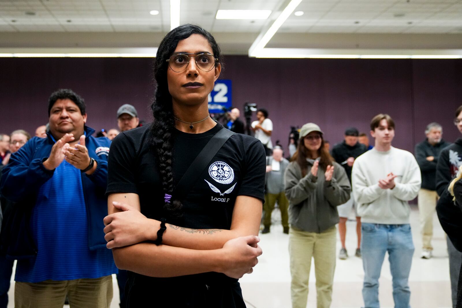 Eep Bolaño listens as IAM District 751 president Jon Holden announces that the union voted to accept a new contract offer from Boeing, Monday, Nov. 4, 2024, at their union hall in Seattle. (AP Photo/Lindsey Wasson)