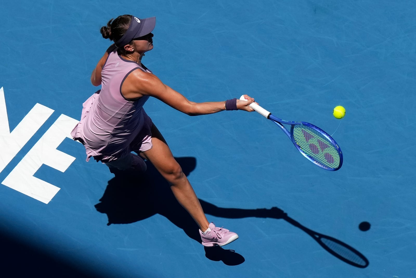 Belinda Bencic of Switzerland returns a shot from Coco Gauff of the U.S. during their fourth round match at the Australian Open tennis championship in Melbourne, Australia, Sunday, Jan. 19, 2025. (AP Photo/Mark Baker)