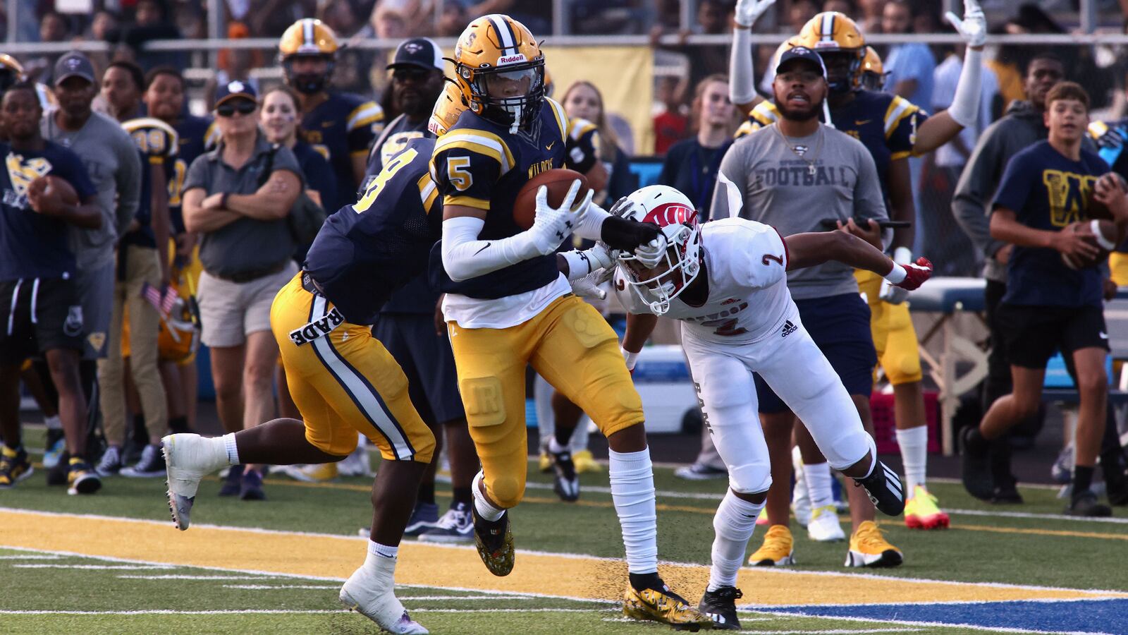 Springfield's Aaron Scott returns an interception for a score against Trotwood-Madison on Friday, Sept. 2, 2022, in Springfield. David Jablonski/Staff